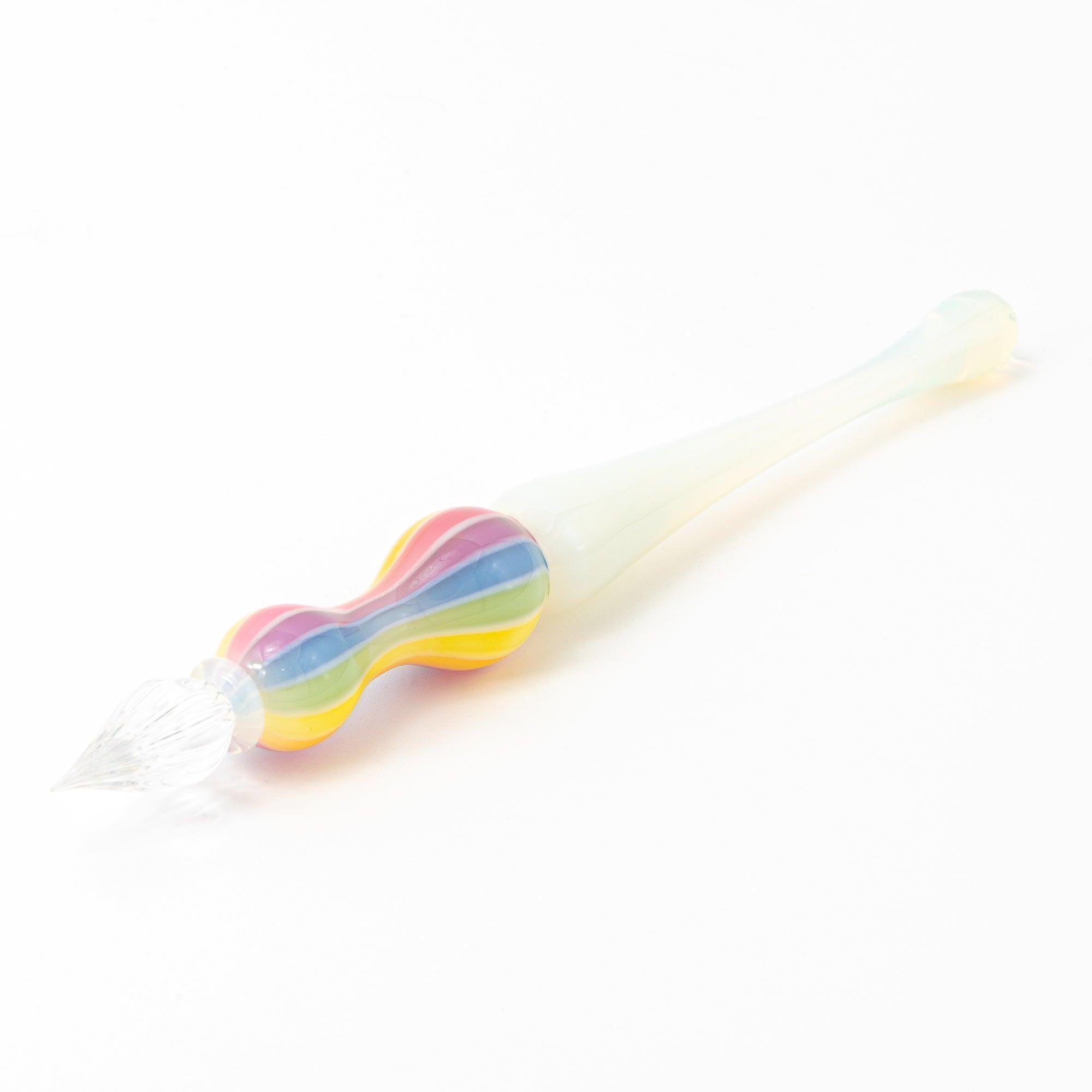 Full view of a glass pen with a rainbow-colored handle on a white background. Ideal for collectors of Japanese stationery.