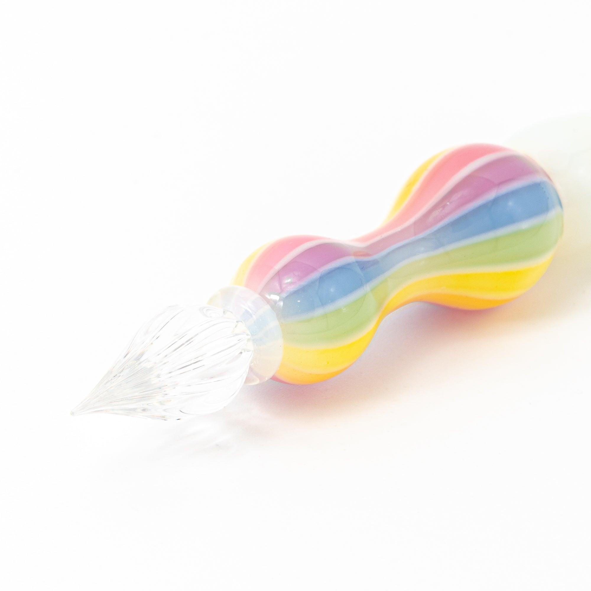 Full view of a glass pen with a rainbow-colored handle on a white background. Ideal for collectors of Japanese stationery.