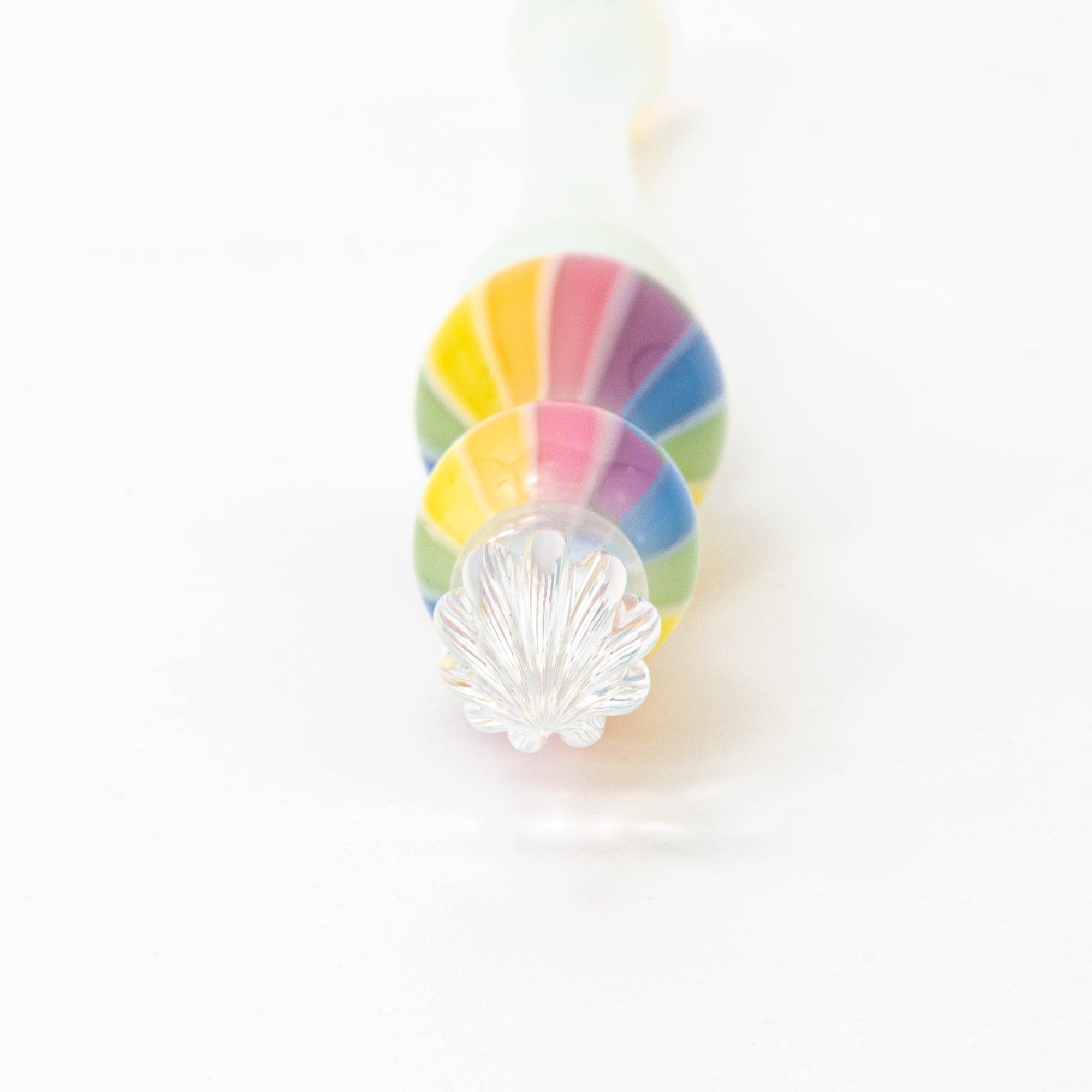 Full view of a glass pen with a rainbow-colored handle on a white background. Ideal for collectors of Japanese stationery.