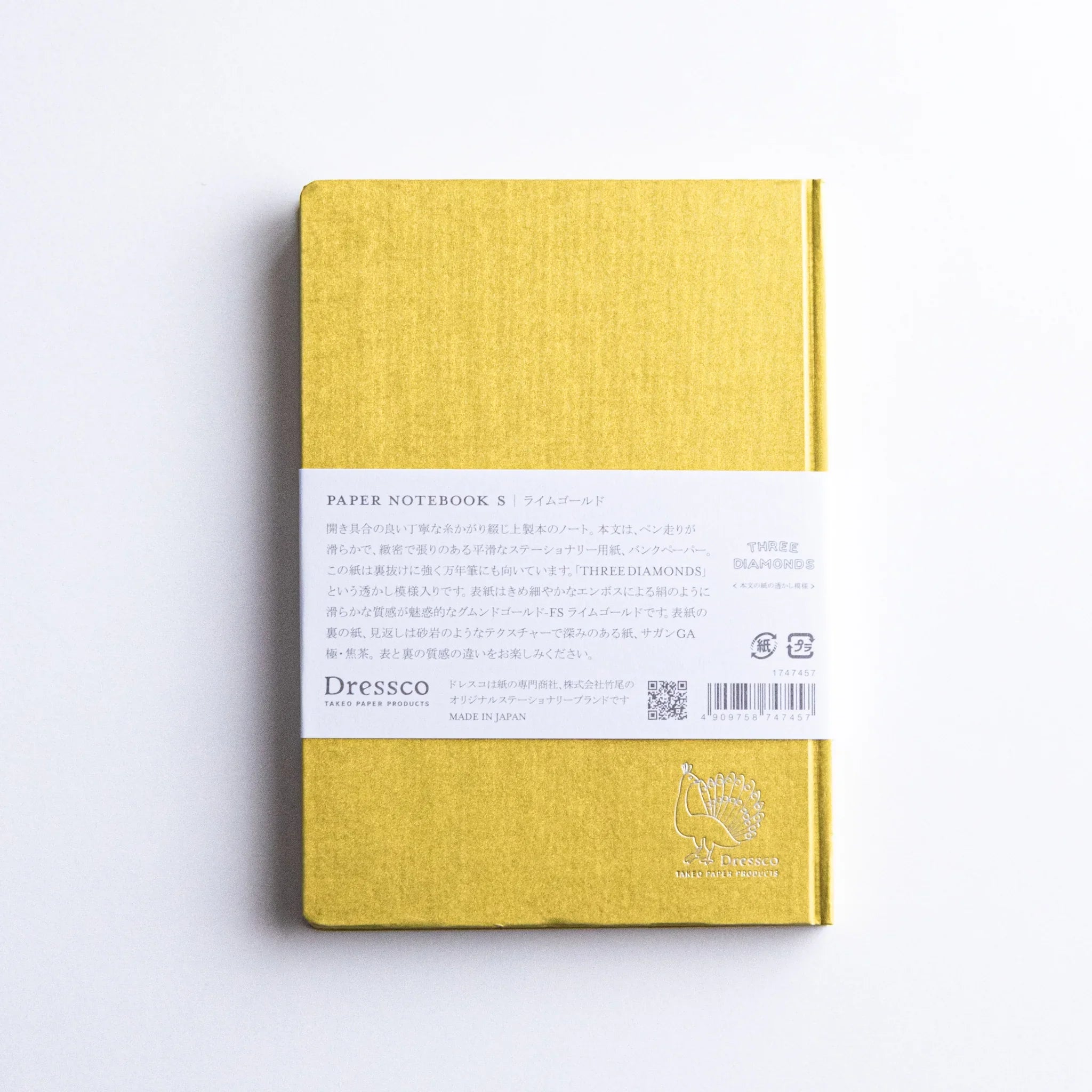 Back cover of Dressco Bank Ledger Paper Japanese Notebook in Lime Gold with product details.