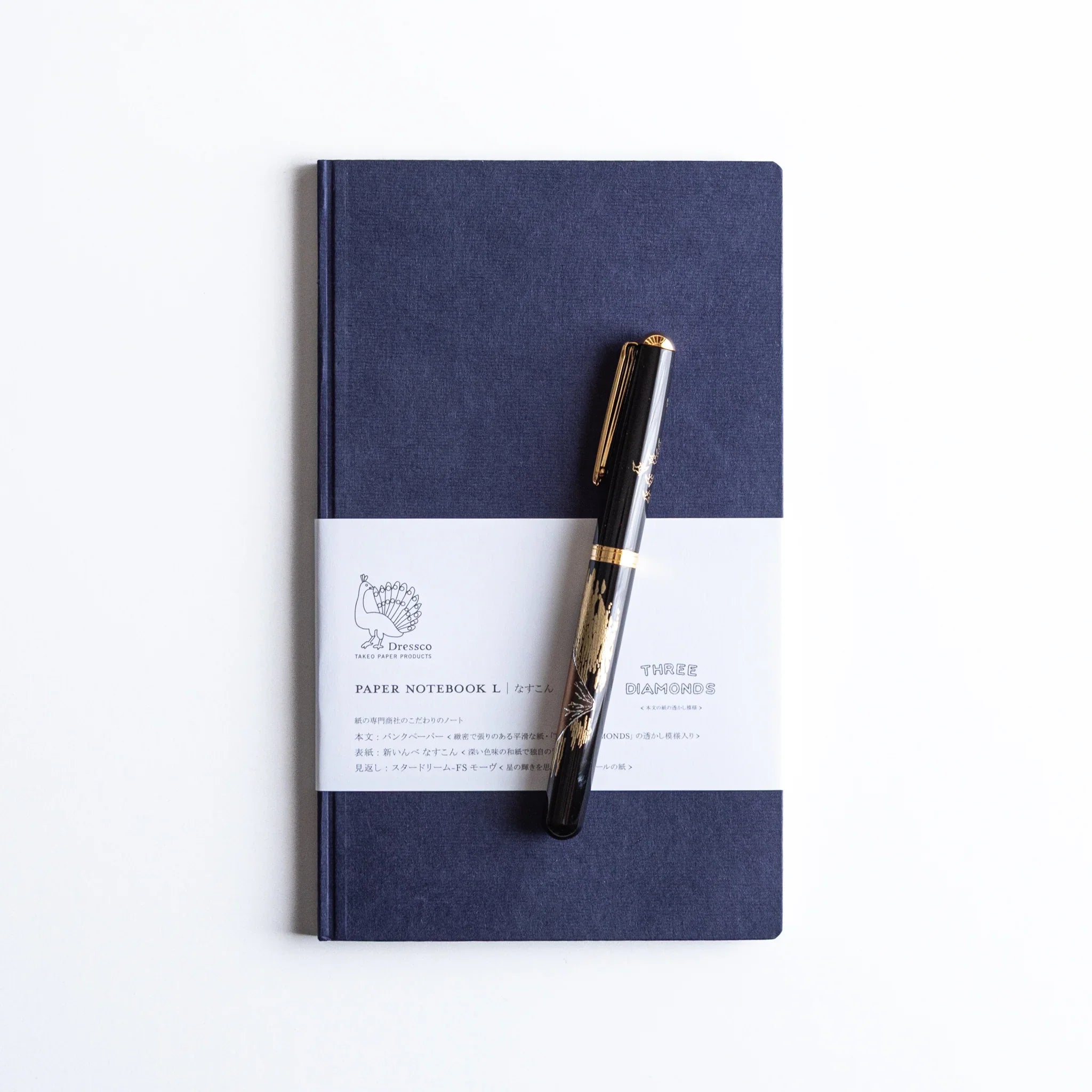 Nasukon Dressco Japanese Notebook with black lacquer Japanese Fountain Pen beside it.