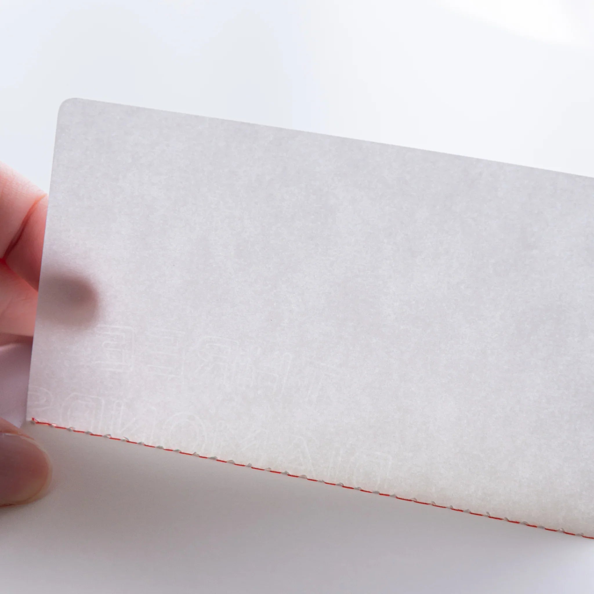 Watermarked paper of Dressco Bank Ledger Paper Stitched Japanese Notebook, Gray, shown under light.