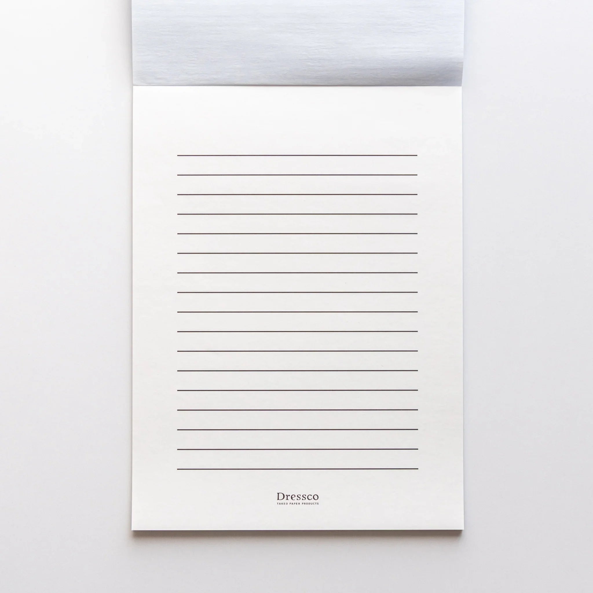 Ruled backing sheet included in Dressco Blue Onion Skin Japanese Paper Writing Pad for neat handwriting.