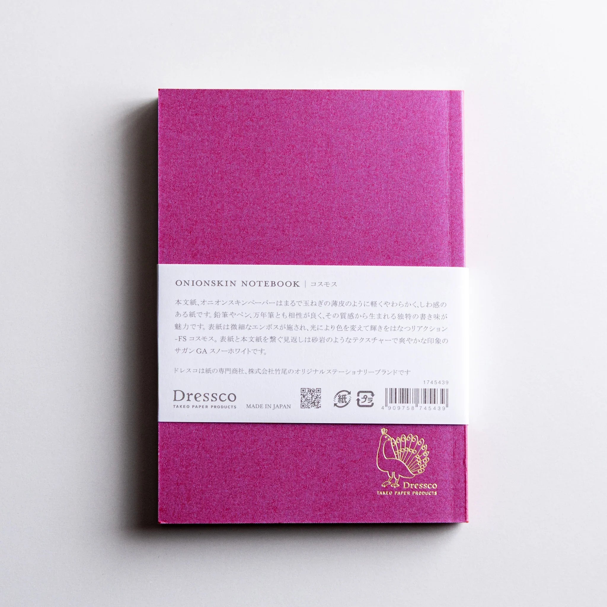 Back view of Dressco Pink Onion Skin Japanese Notebook A6 with white band and gold logo.