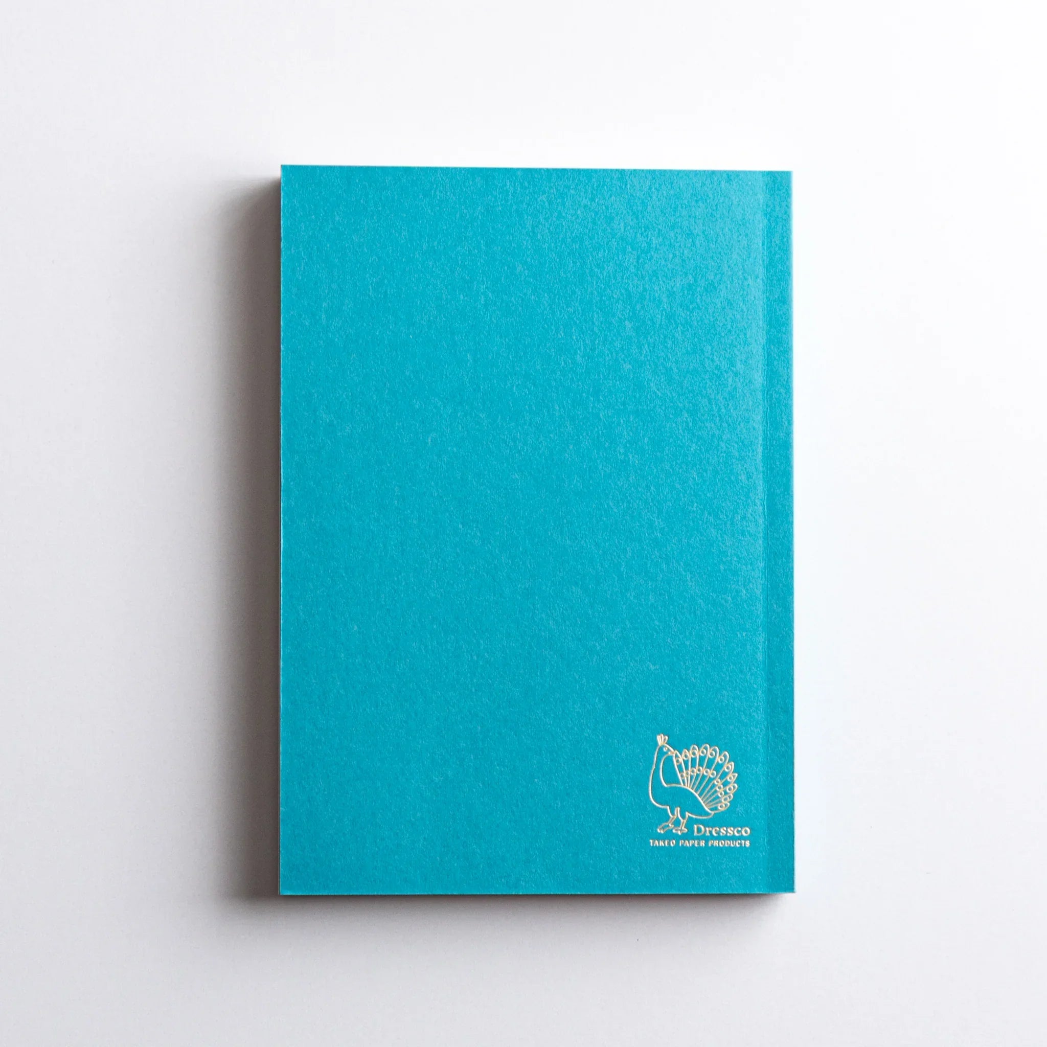 Back cover of Dressco Teal Blue Onion Skin Japanese Notebook A6 with gold peacock Dressco logo.