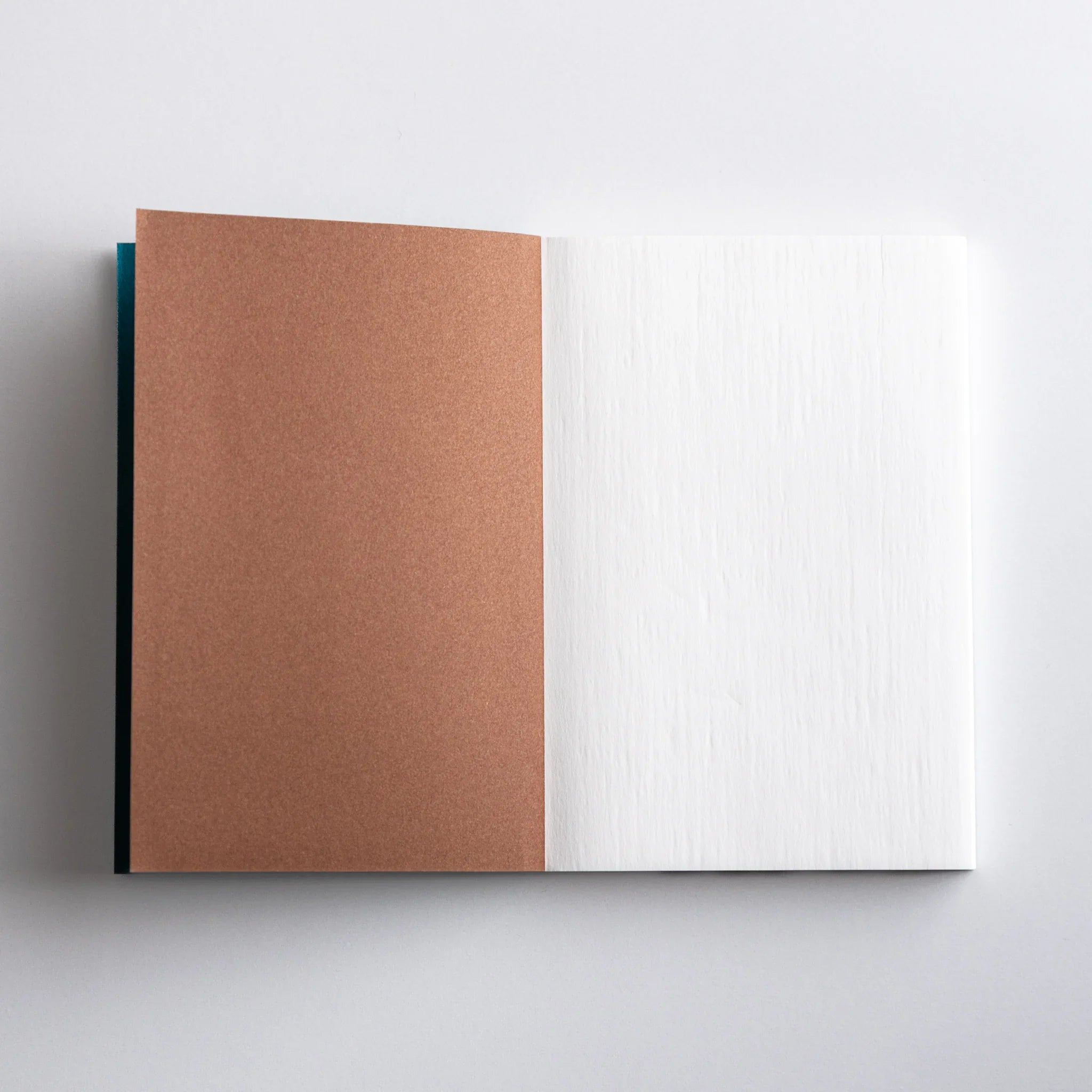 Inside pages of Dressco Teal Blue Onion Skin Japanese Notebook A6 showing crisp onion-skin paper texture.