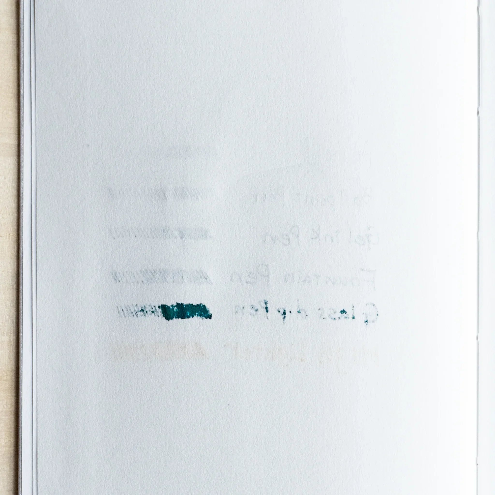 Backside of writing test on Spica Laid Bond Paper showing minimal bleed-through from pencil, gel ink, fountain, and dip pens.