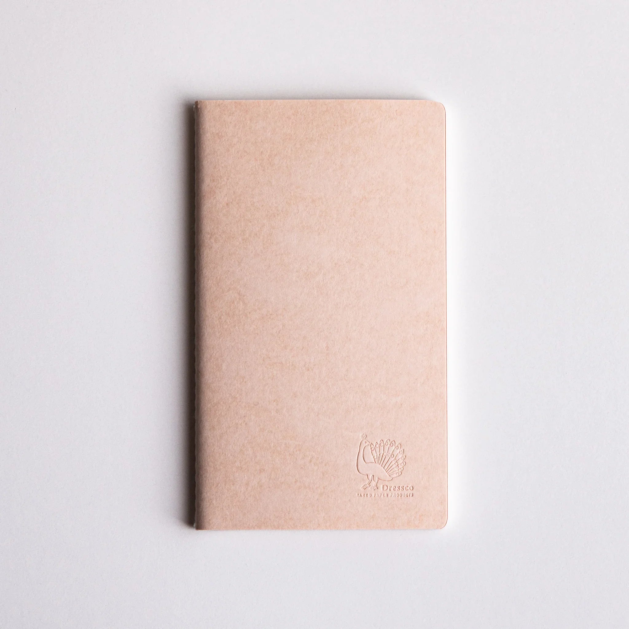 Ivory Japanese notebook with embossed peacock logo made from Bank Ledger Paper.