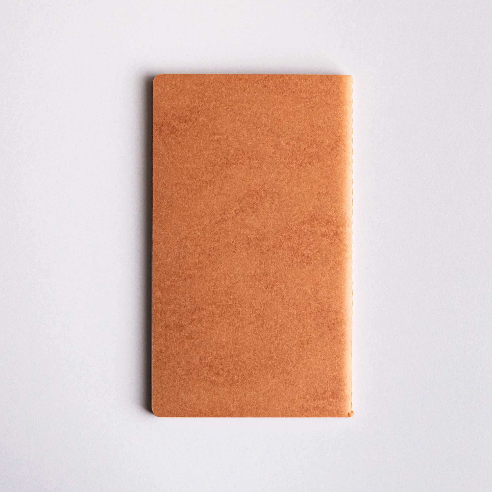 Front view of brown Japanese notebook made from Bank Ledger Paper, part of three notebook set.