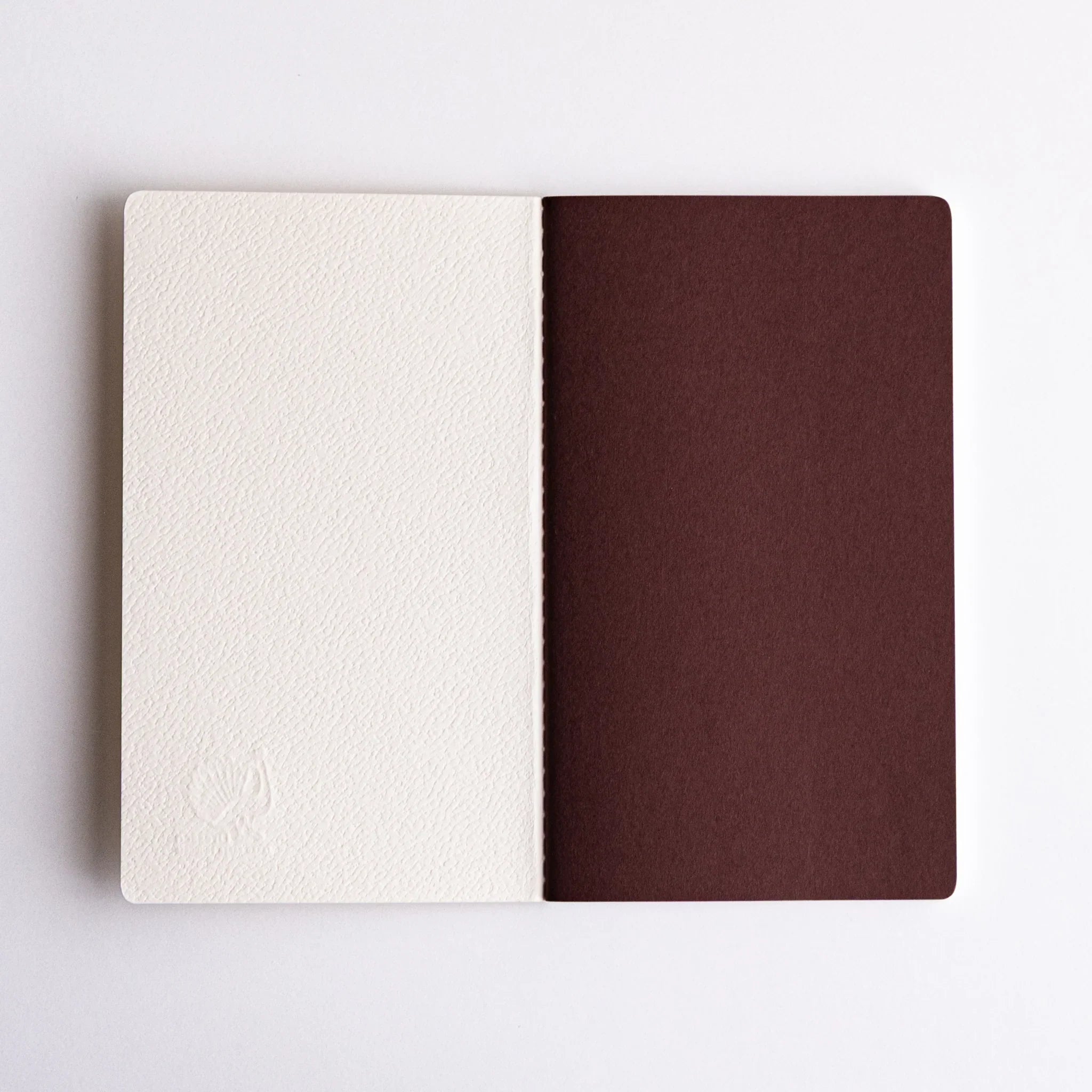 Open Japanese notebooks made from Spica Laid Bond Paper (white).