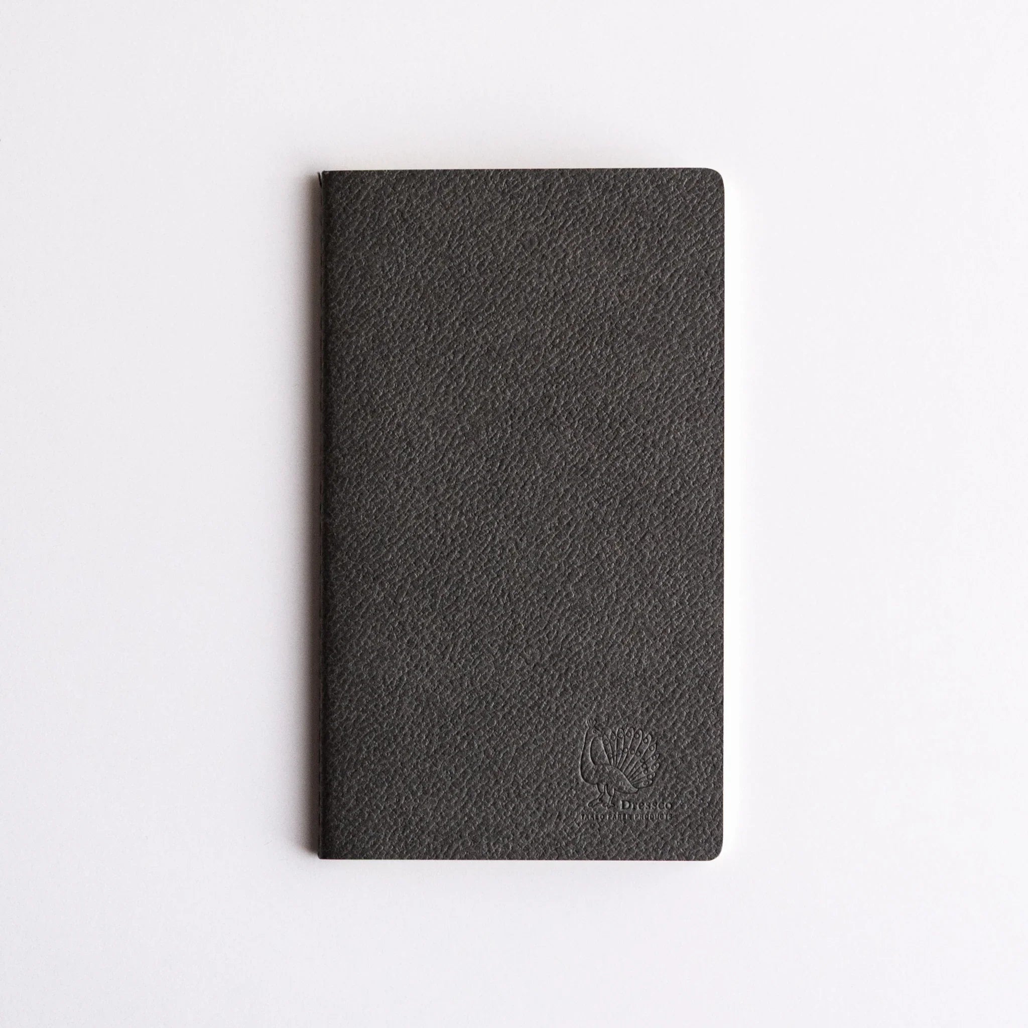 Bank Ledger Paper Japanese notebook with textured dark gray cover and stitched binding, featuring an embossed peacock logo.