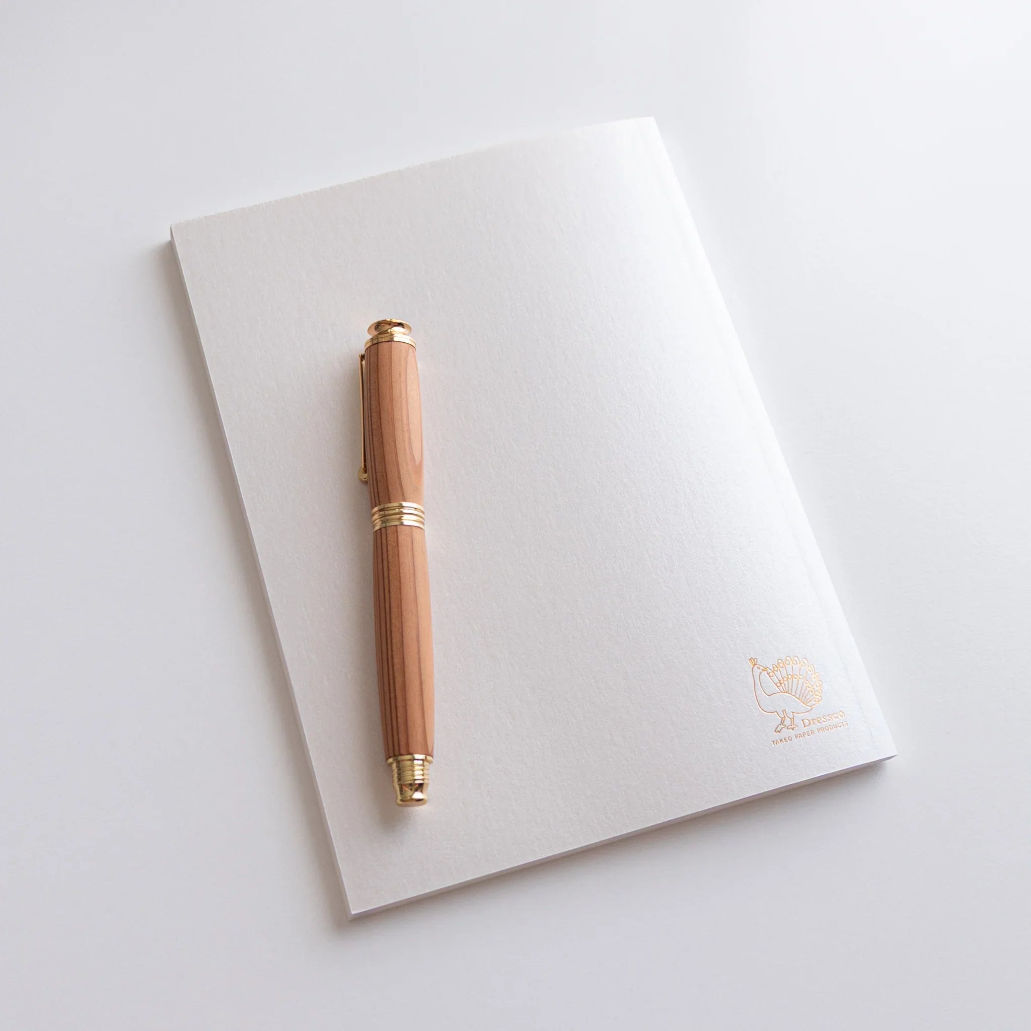 Back view of Dressco White Onion Skin Japanese Notebook B6, showing Dressco logo and product description in Japanese.