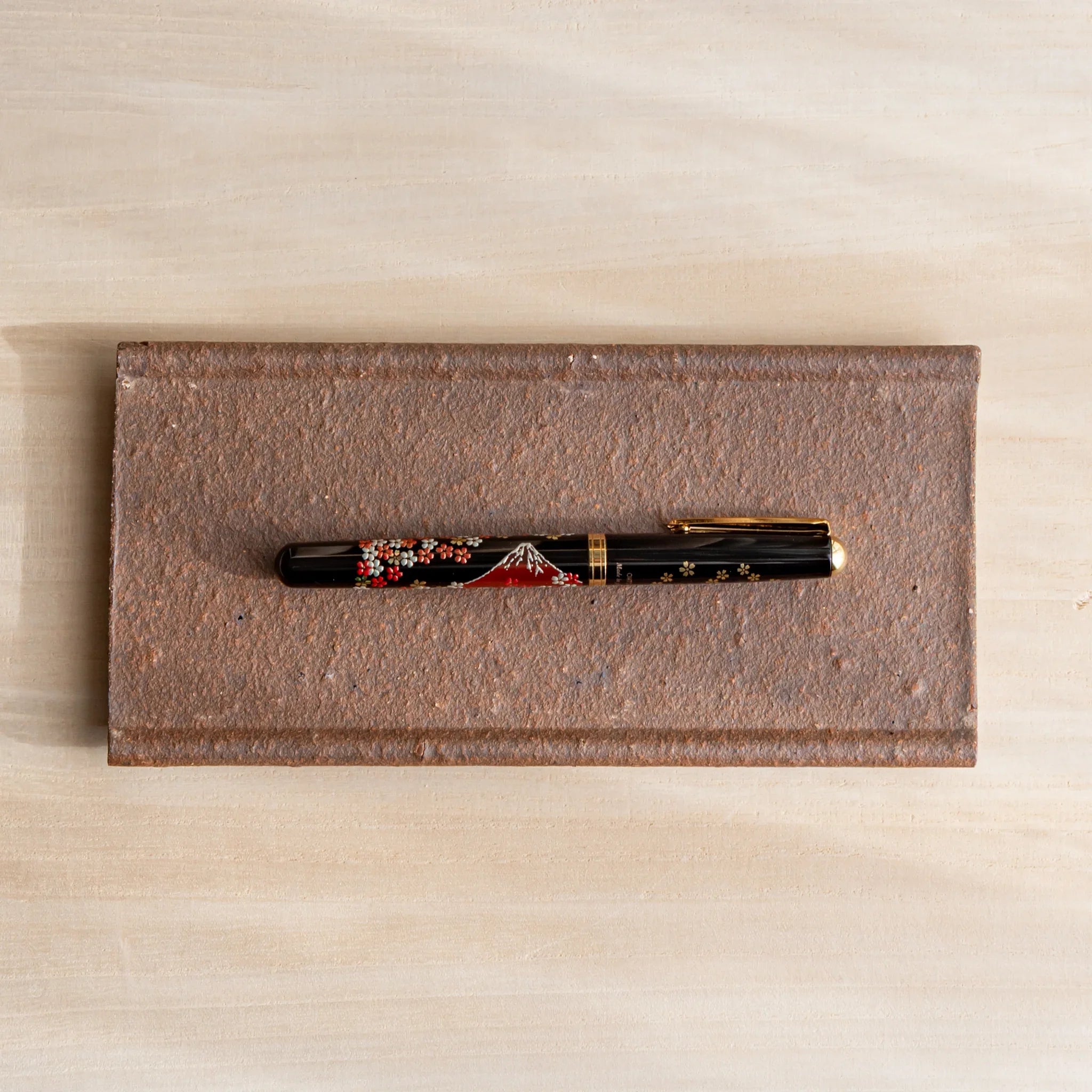 Japanese Pen Tray Desk Accessory with yakishime clay ceramic tray, holding a fountain pen.