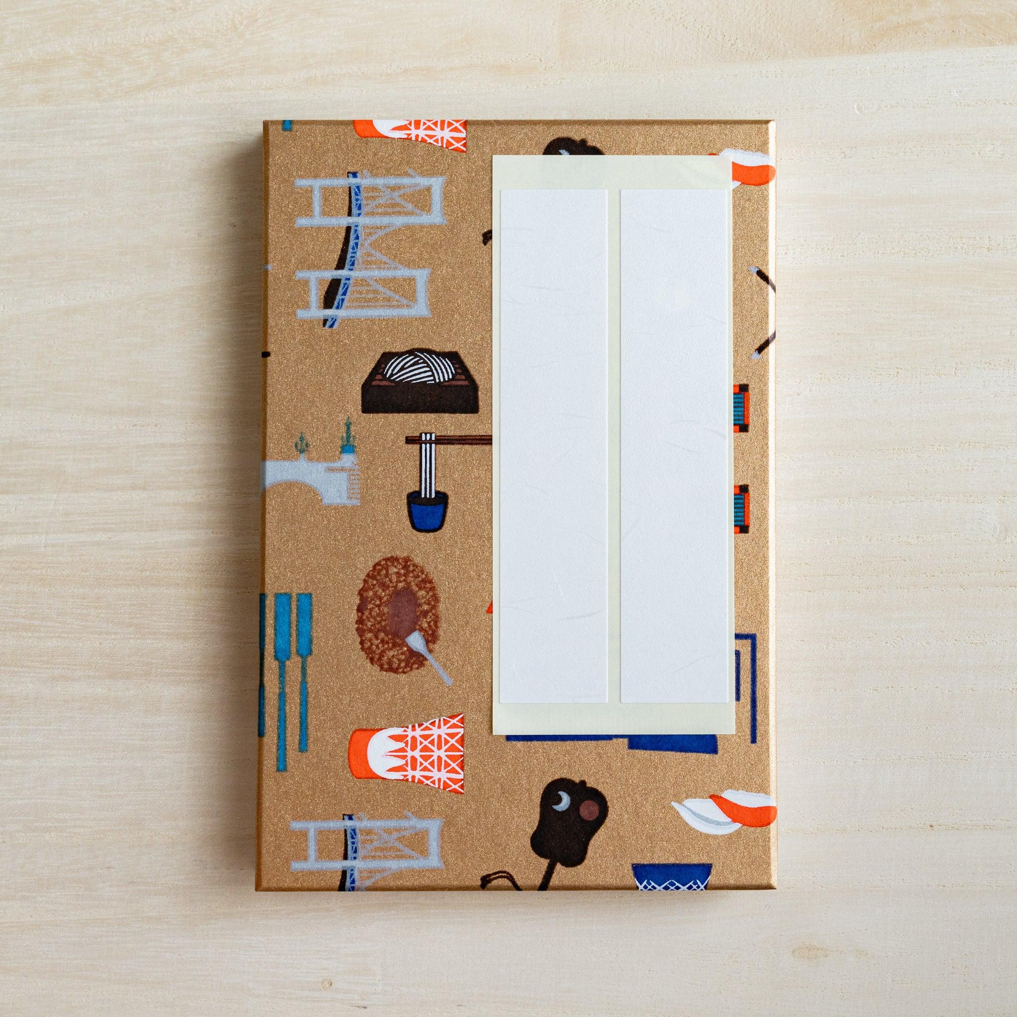 Edo Tokyo goshuincho stamp book gold cover with two blank white paper title labels placed on it