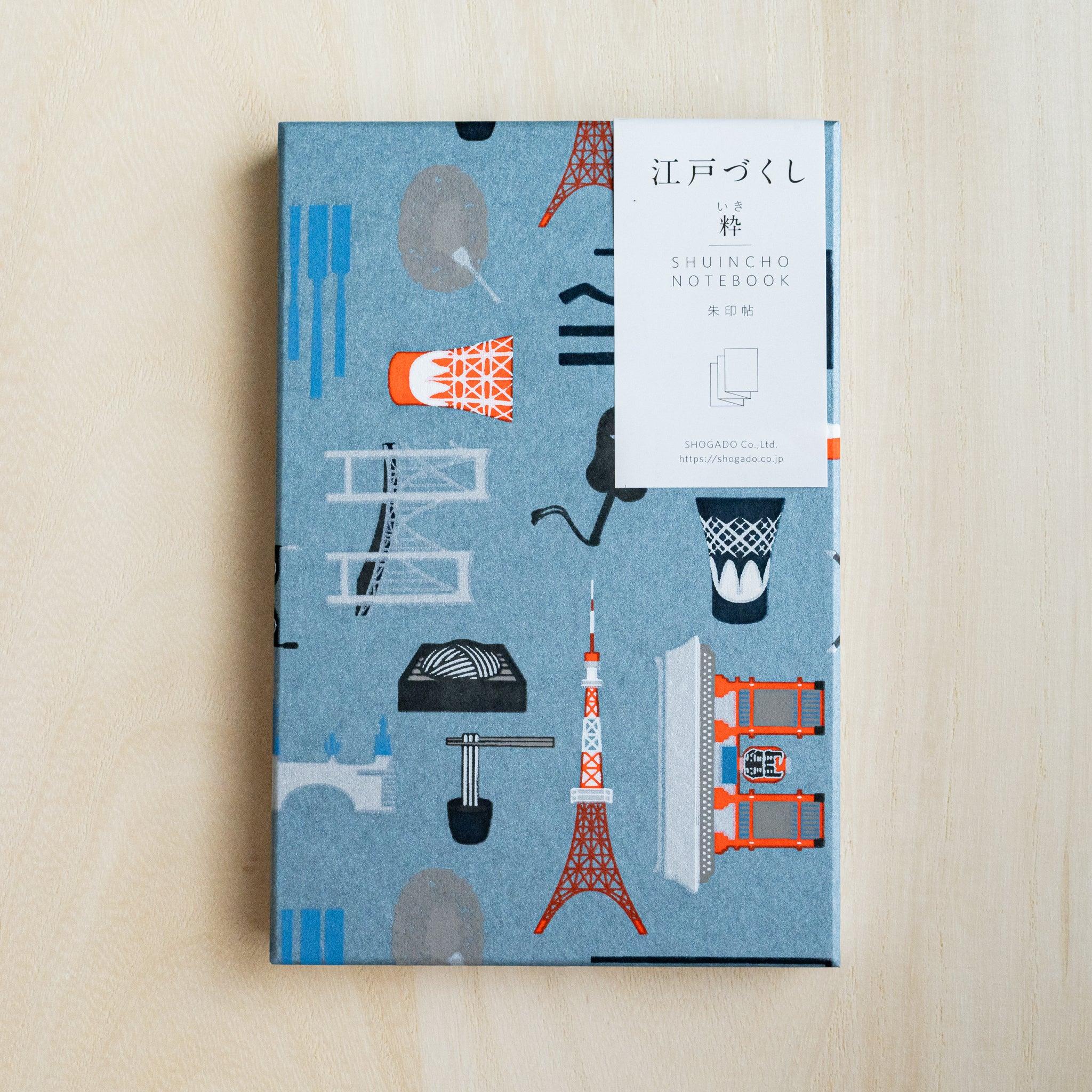 Edo Tokyo goshuincho stamp book, slate blue washi cover with orange Tokyo Tower motifs, white paper belly band