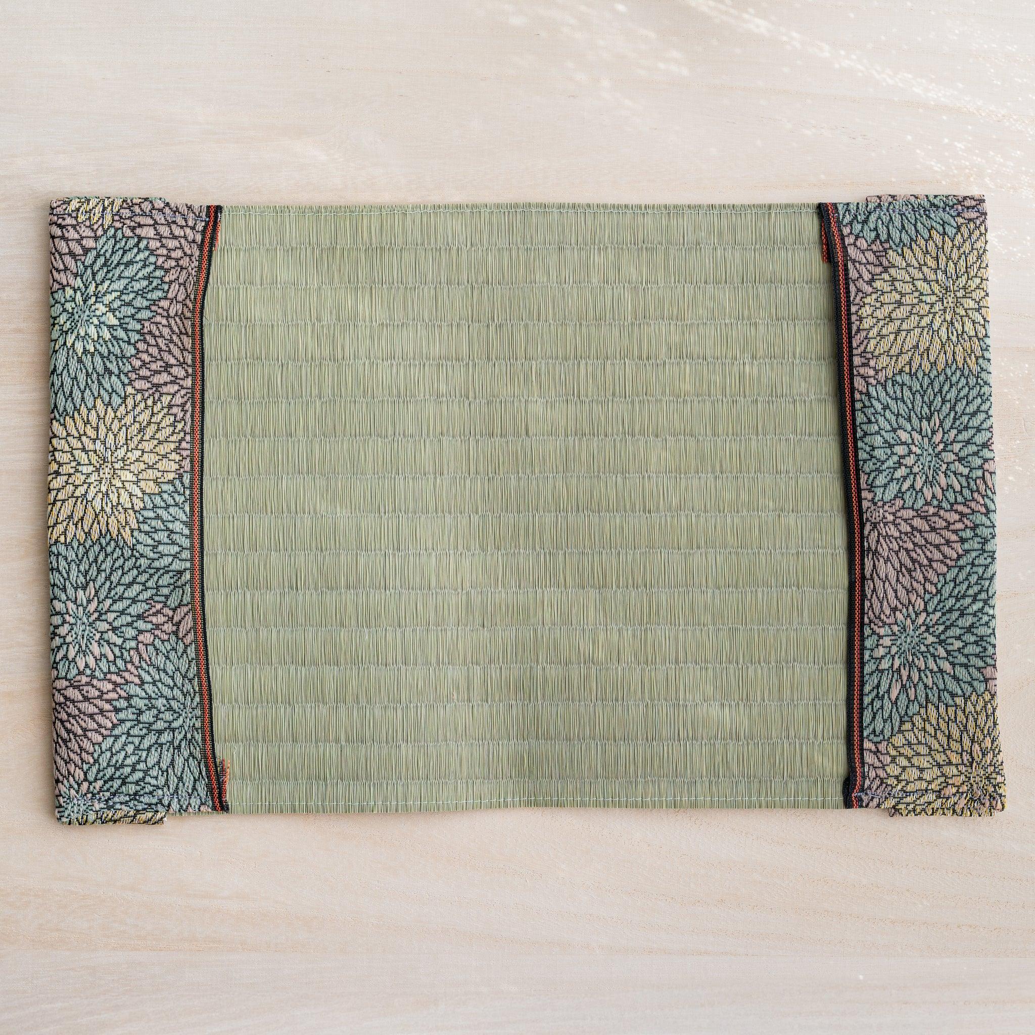 Tatami book cover unfolded flat, inner side up, rush straw center with chrysanthemum flaps and orange striped trim