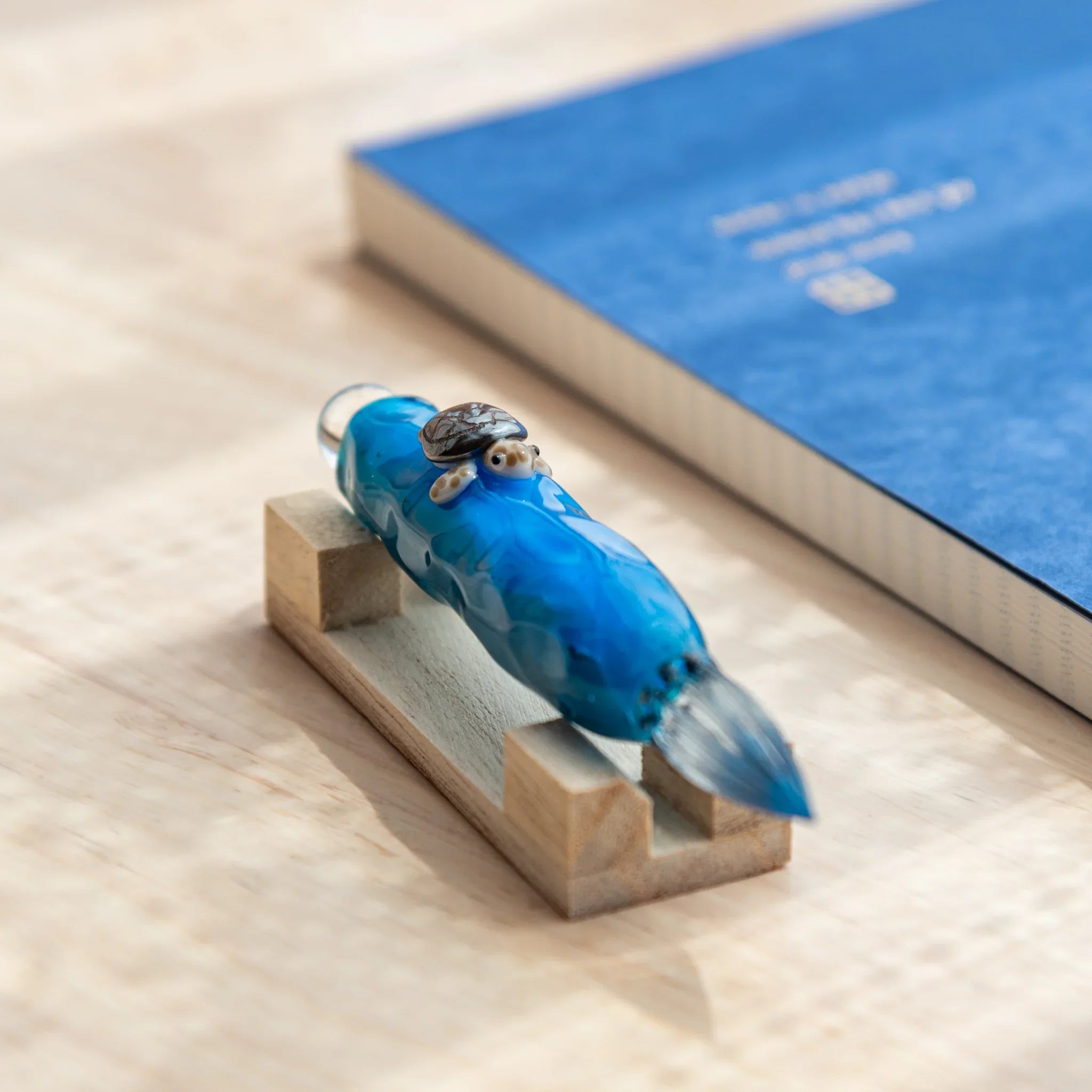 Floating Sea Turtle Japanese Glass Dip Pen highlighting turtle detail on handcrafted ocean-blue glass body.