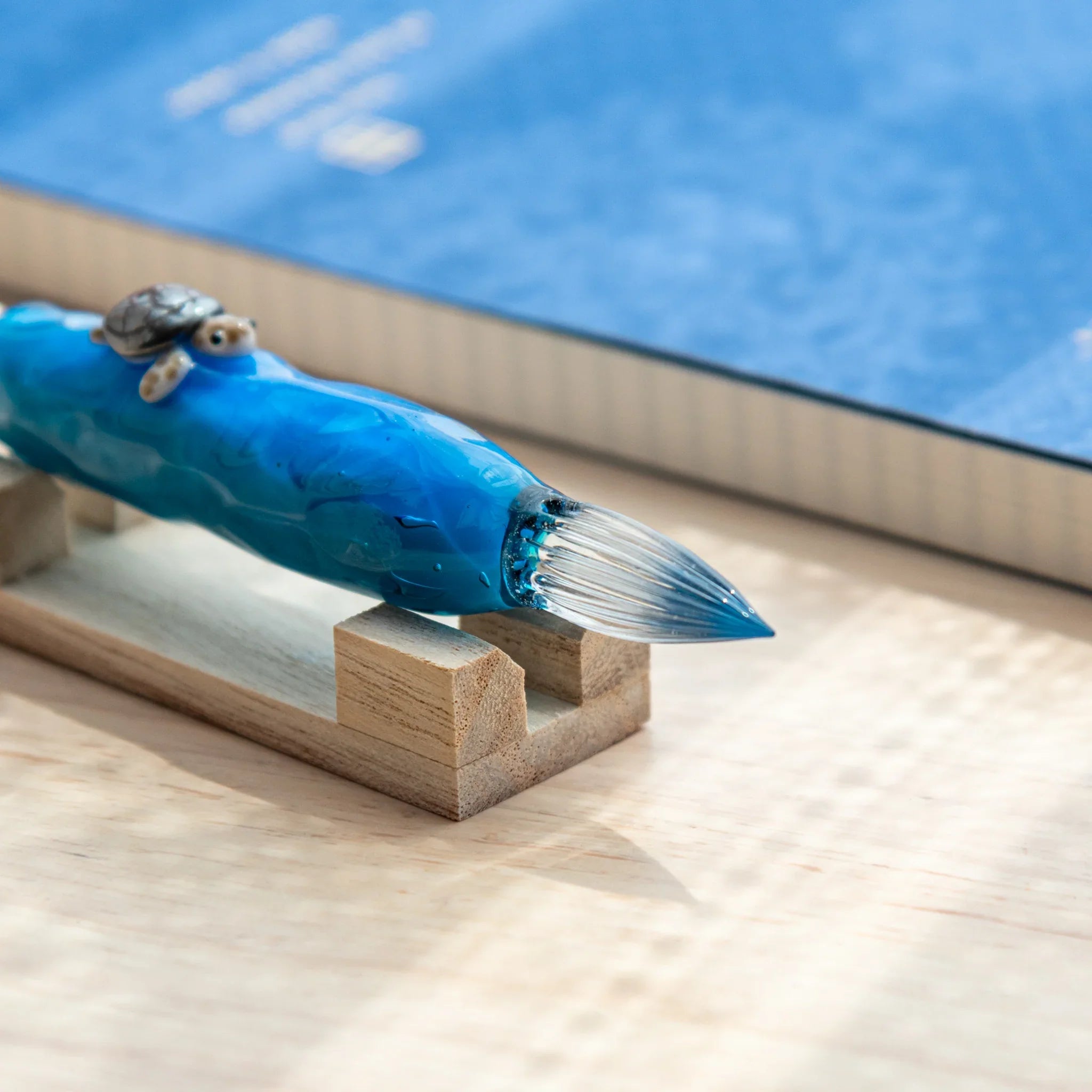 Floating Sea Turtle Japanese Glass Dip Pen in vivid blue glass, turtle motif, and wooden pen holder display.
