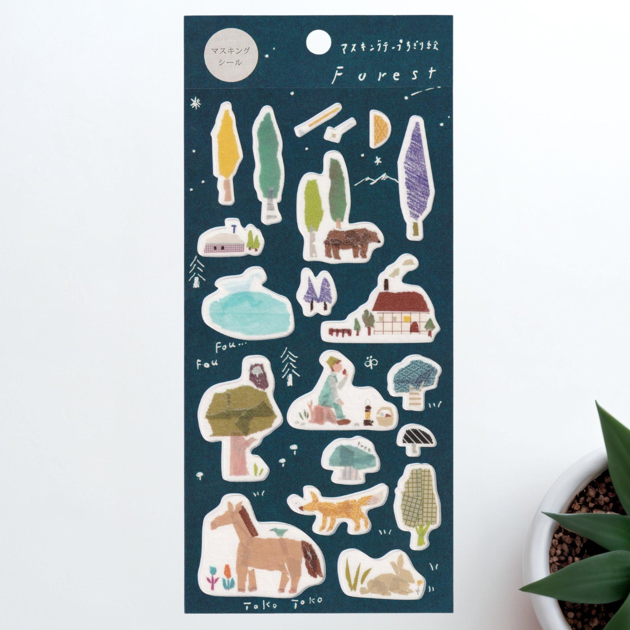 A Japanese stationery washi sticker sheet featuring forest-themed designs, including trees, animals, cottages, and campfires, beautifully illustrated in a dreamy watercolor style.