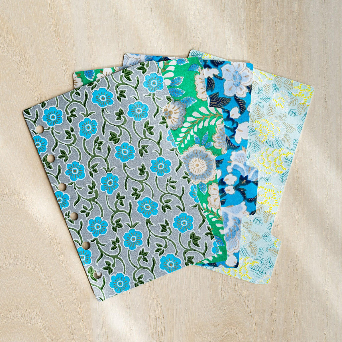 Four Garden Yuzen washi index dividers for Mini 6 planners fanned out, grey, green and blue floral prints