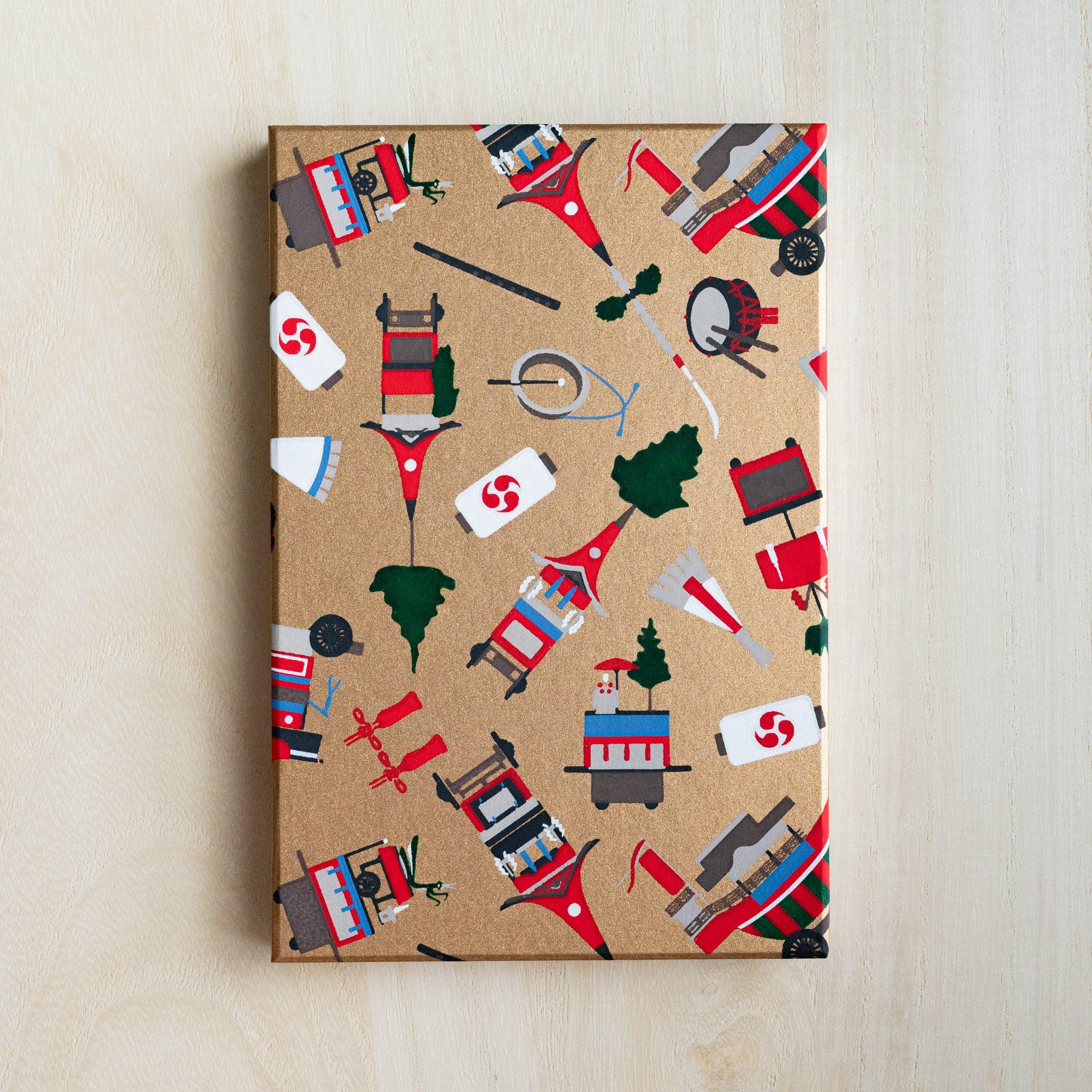 Gion Kyoto goshuincho stamp book cover in gold washi with red floats, pine trees and taiko drums