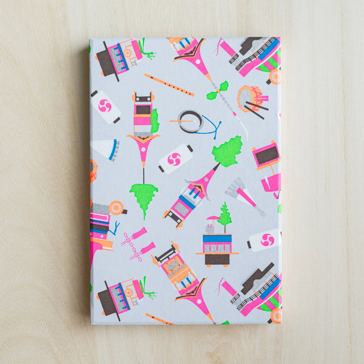 Gion Kyoto goshuincho stamp book cover in pale gray washi with neon pink floats, taiko drums and flutes