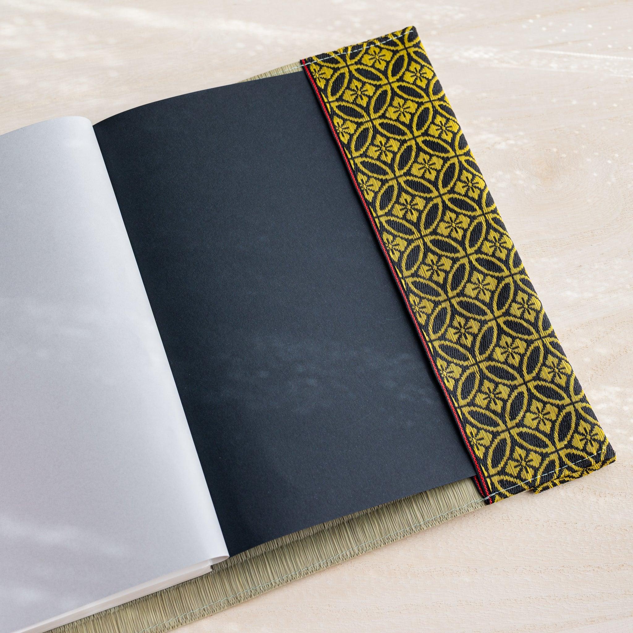 Gold Shippo tatami book cover inner flap open showing black notebook cover and black and gold patterned fabric band