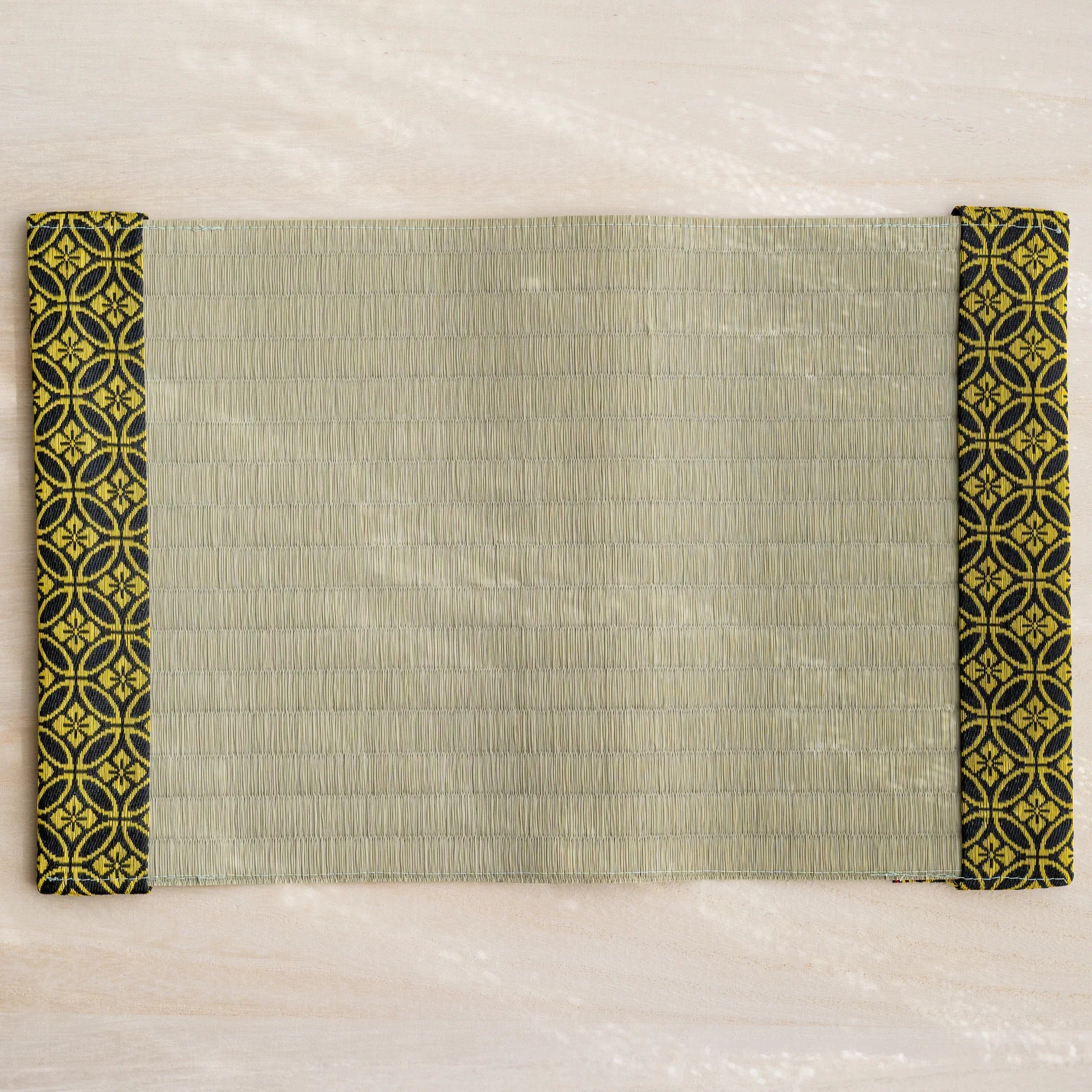 Gold Shippo tatami book cover unfolded flat, outer side up, rush straw center with patterned flaps at both ends