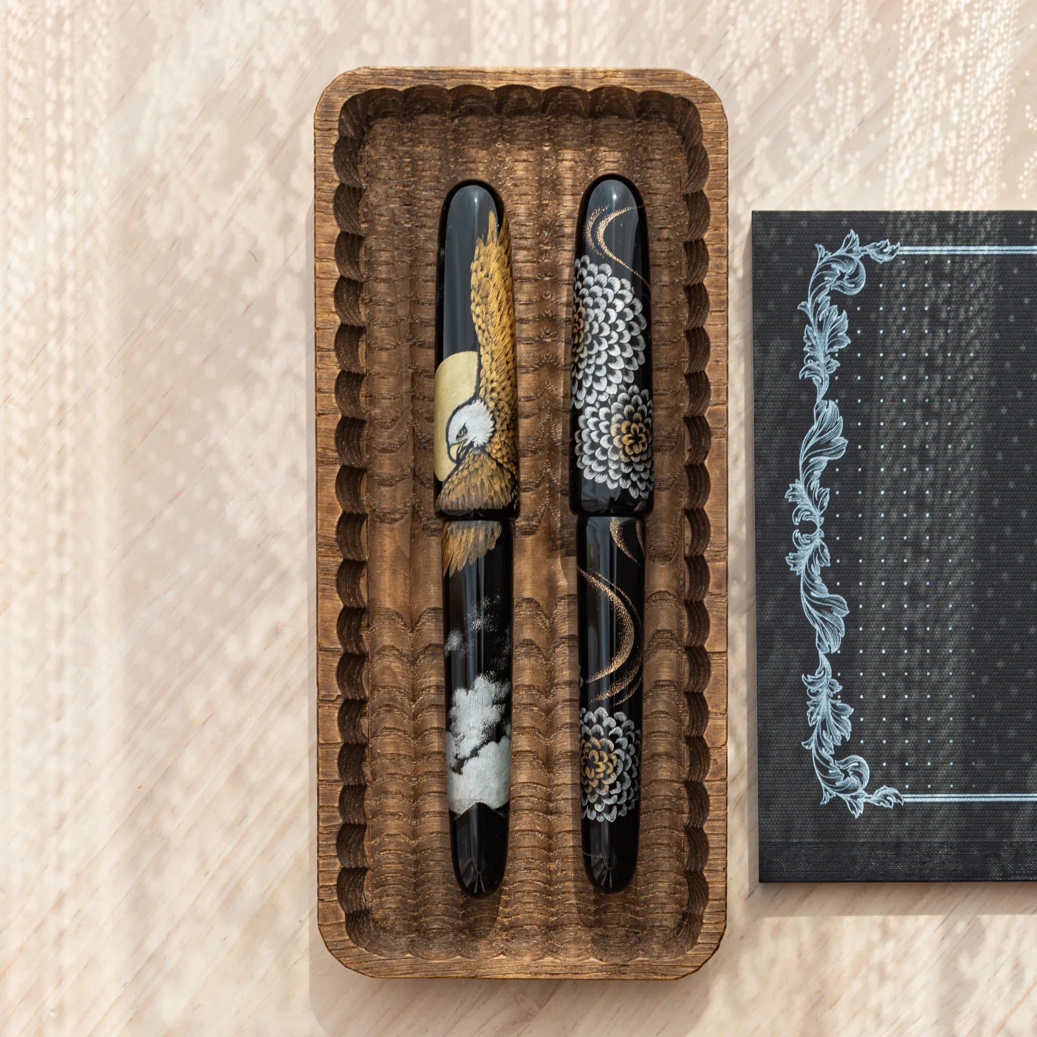 Japanese Fountain Pens with crane and chrysanthemum motifs displayed in a Wagatabon Pen Tray.