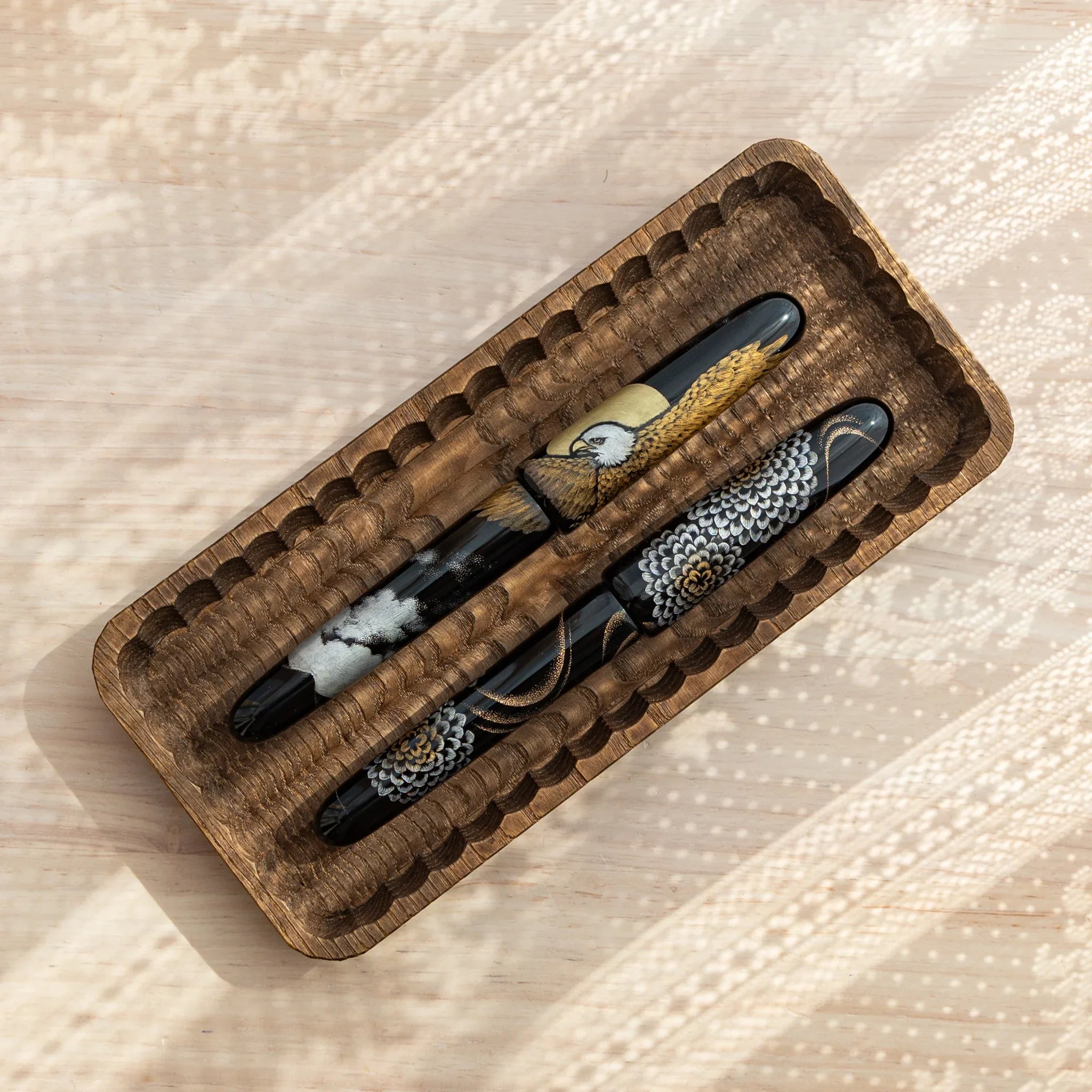 Japanese Fountain Pens with crane and chrysanthemum motifs displayed in a Wagatabon Pen Tray.