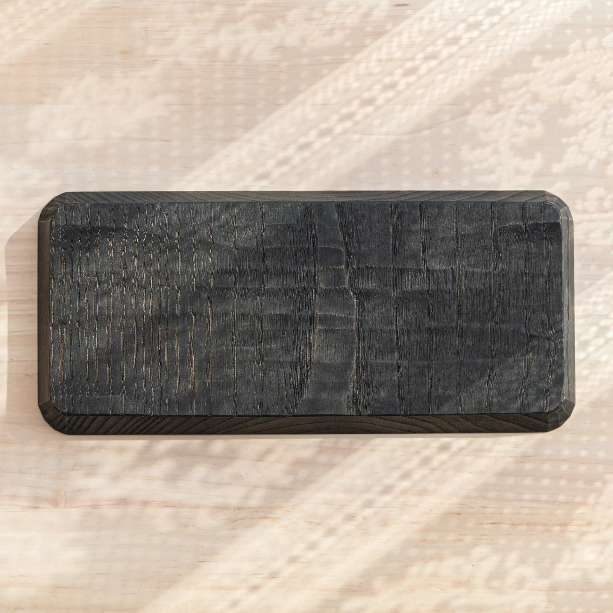 Bottom view of the Hand-Carved Japanese Pen Tray, showing natural wood grain texture.
