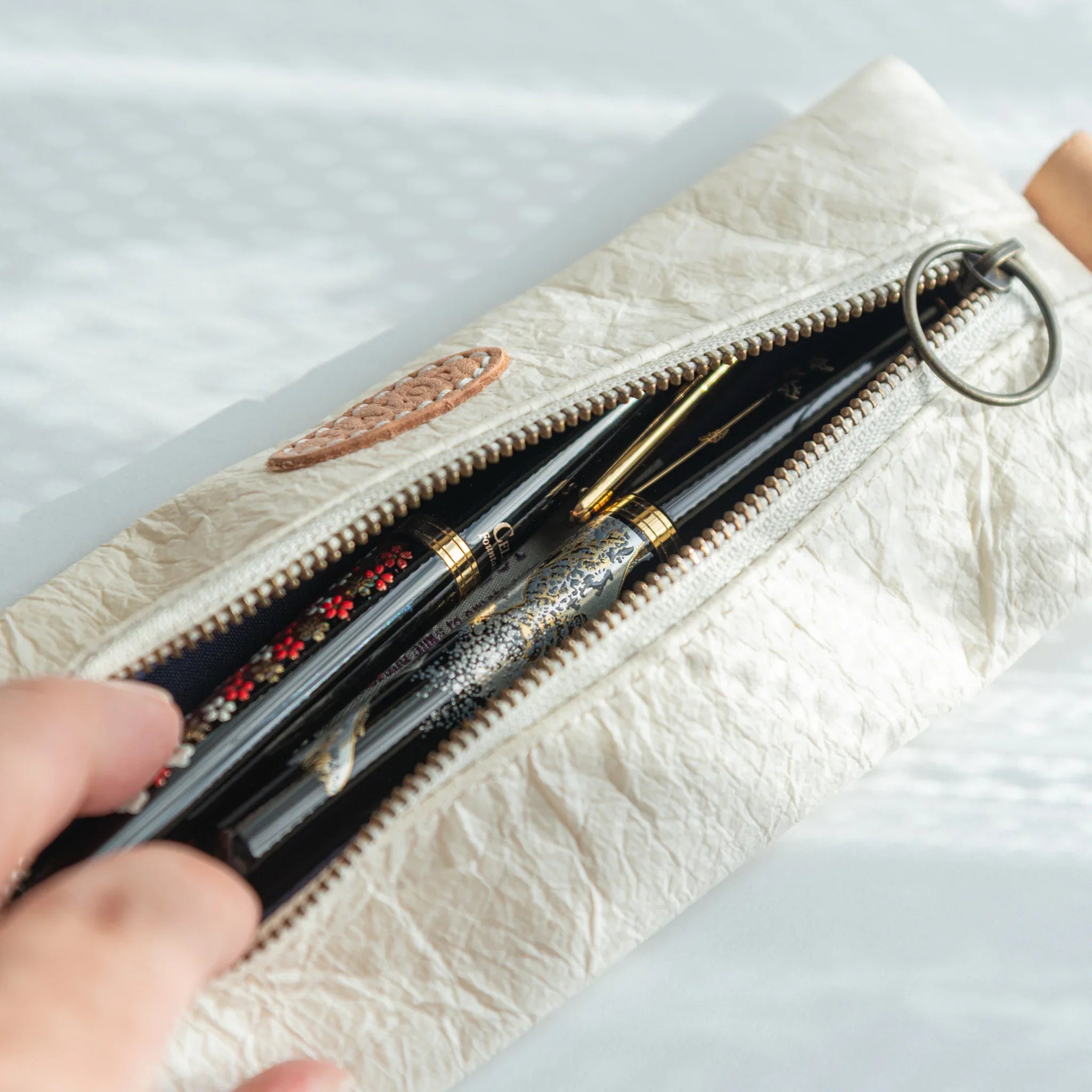 Handcrafted white Japanese Pen Case holding two Japanese Fountain Pens with lacquer design, blending elegance and craft.