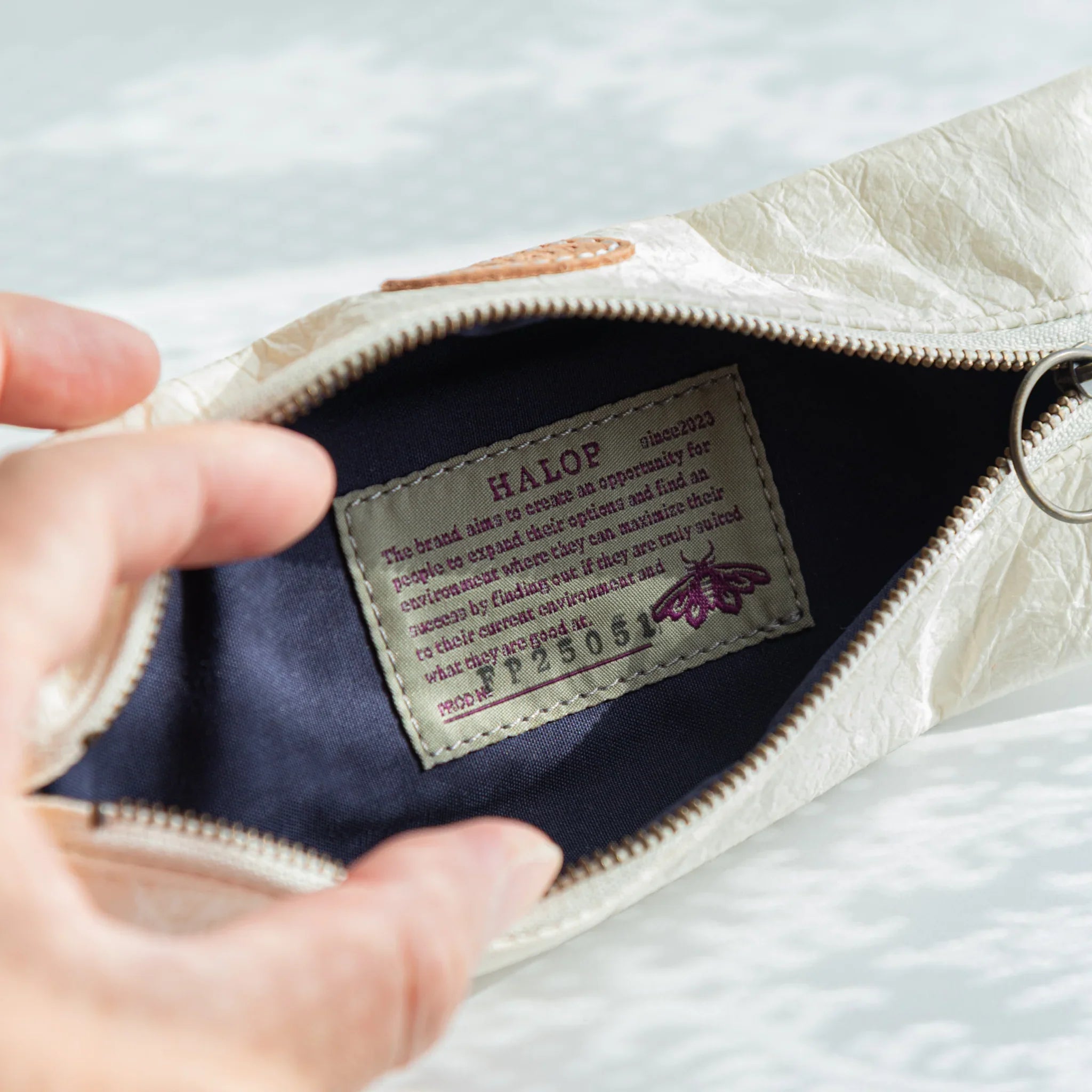Inside view of the Japanese Pen Case showing HALOP brand label stitched on dark lining made from Banshu-ori fabric.