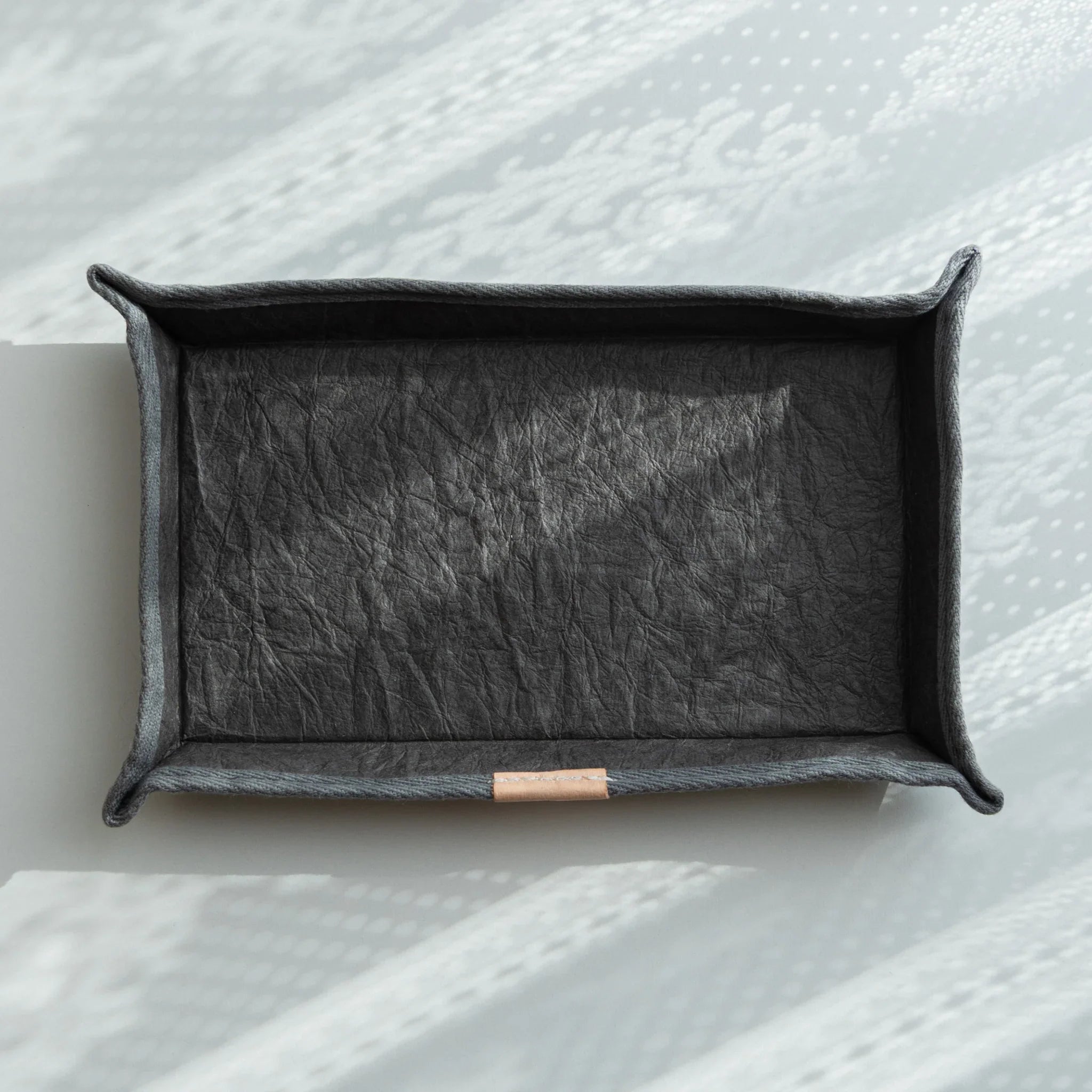 Handcrafted Sugihara Washi Paper Japanese Pen Tray in grey, showcasing textured washi surface under soft daylight.