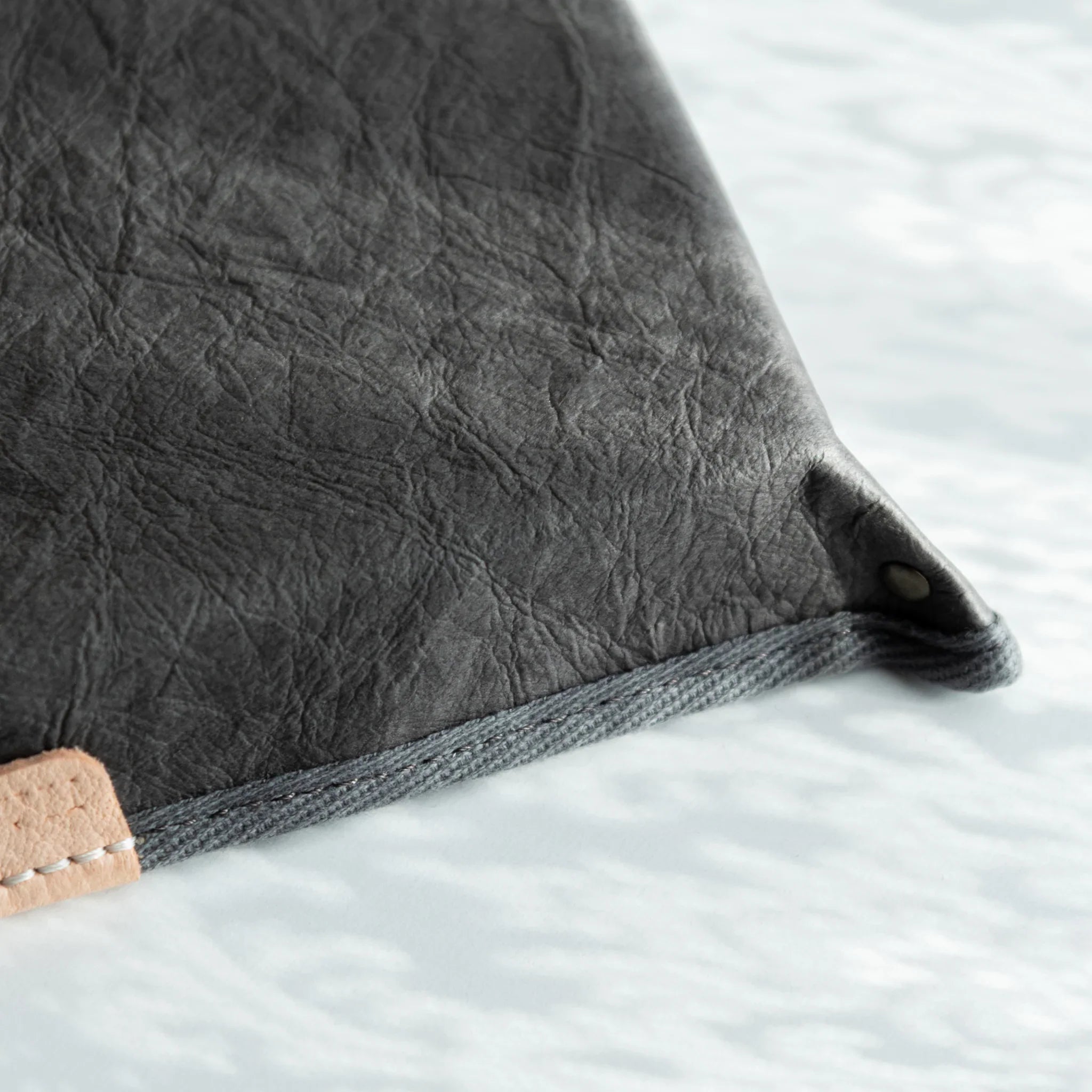 Macro shot of the grey Sugihara washi surface on Japanese Pen Tray, revealing natural fiber texture and depth.