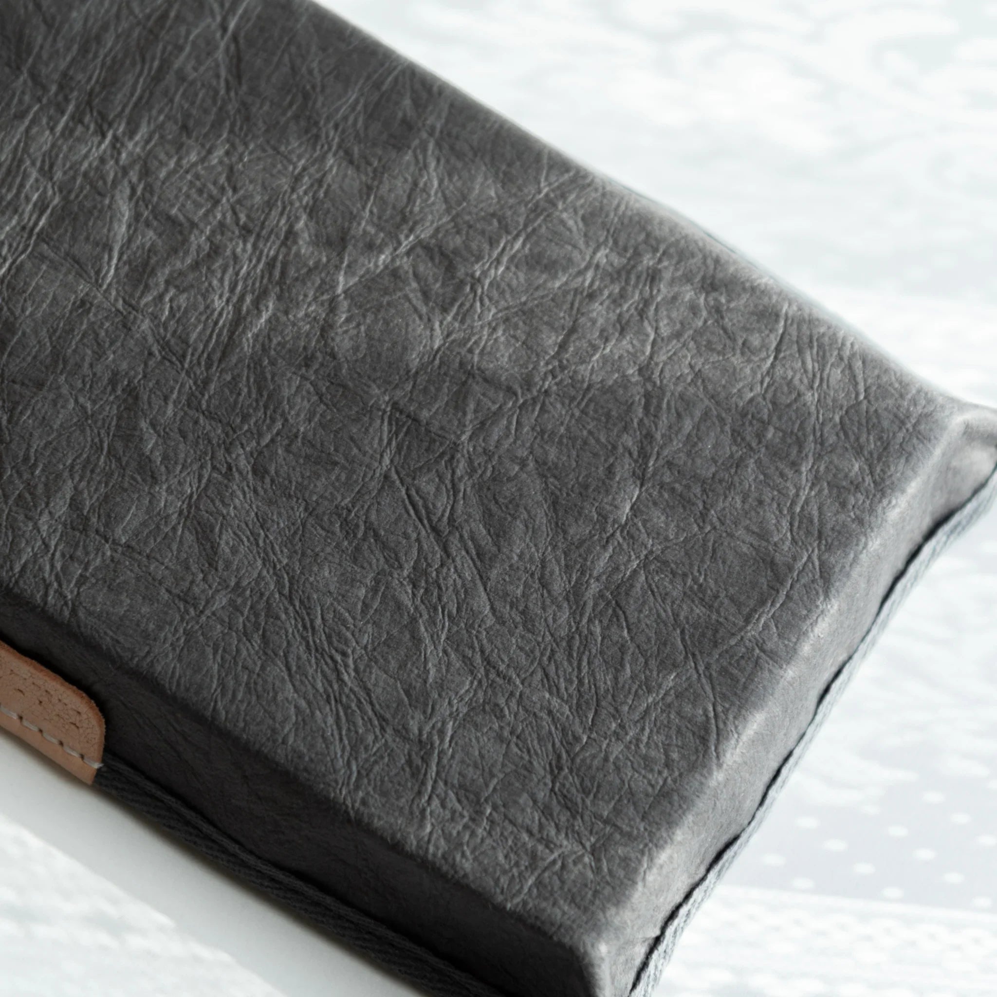 Macro shot of the grey Sugihara washi surface on Japanese Pen Tray, revealing natural fiber texture and depth.
