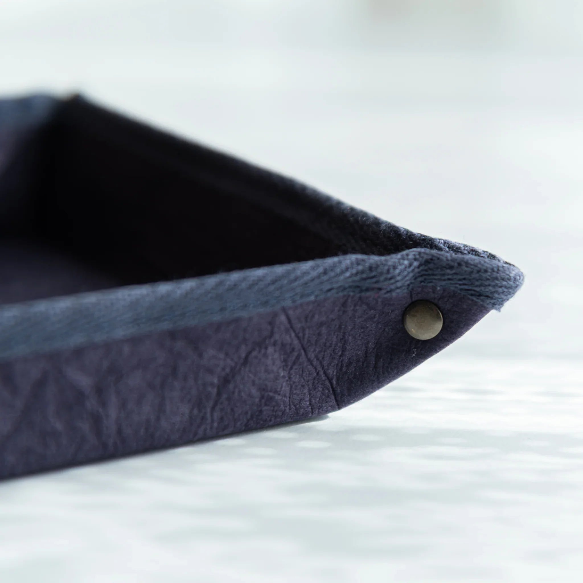 Corner detail of Japanese Pen Tray showing riveted edge and fine washi texture, a blend of durability and beauty.