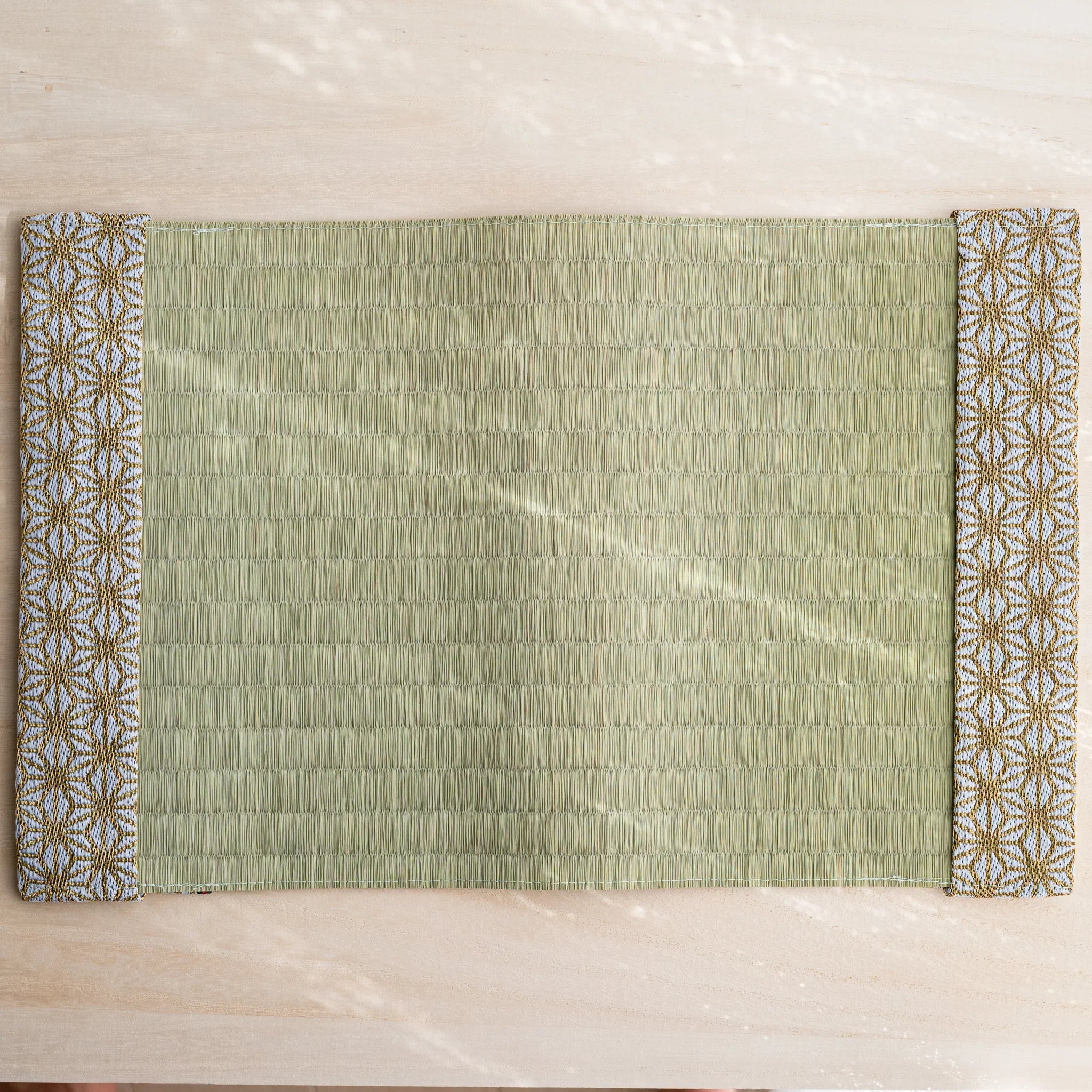 Hemp Leaves tatami book cover unfolded flat, outer side up, rush straw center with hemp leaf flaps at both ends