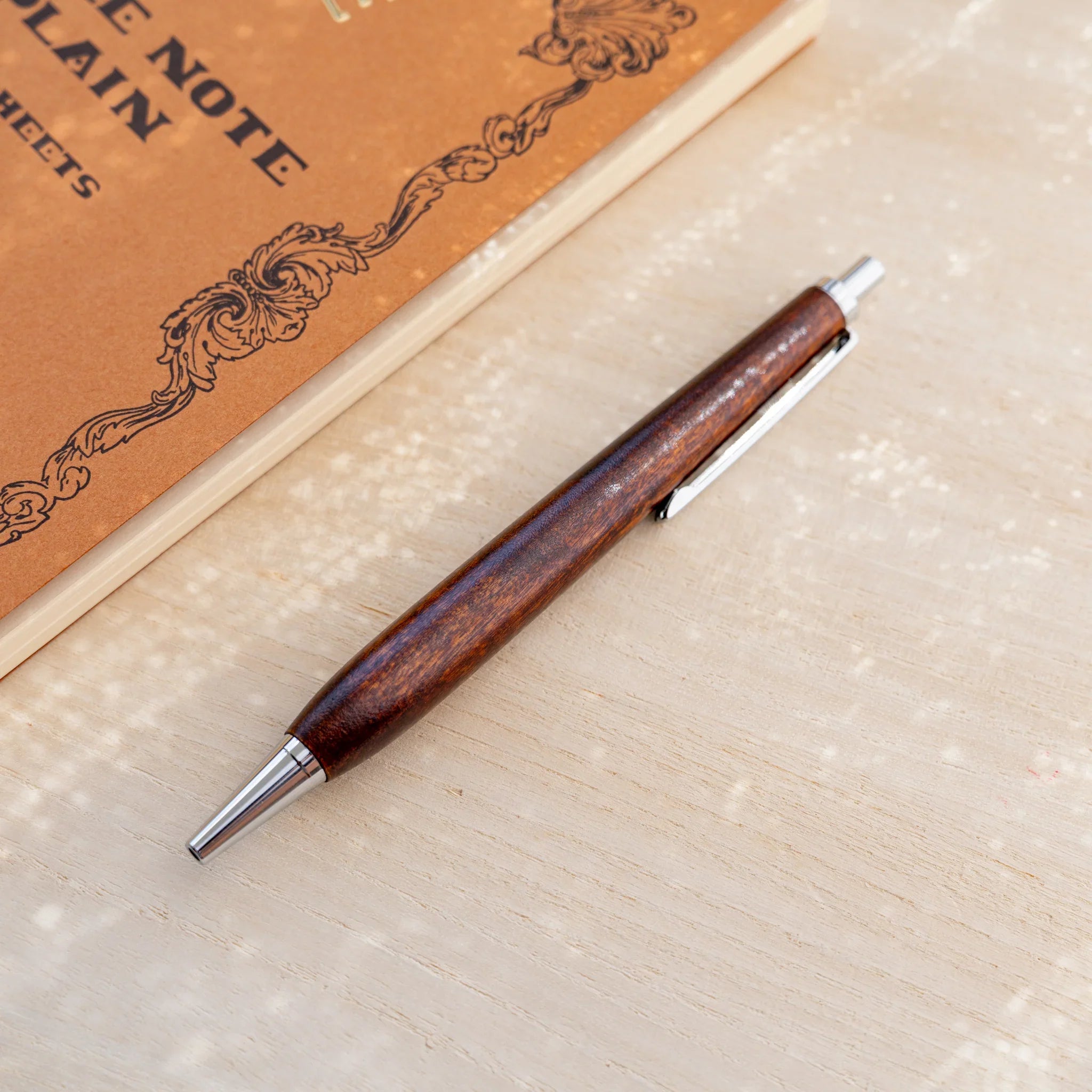 Horse chestnut wood urushi lacquered ballpoint pen in amber-brown, Japanese wood, silver knock and clip