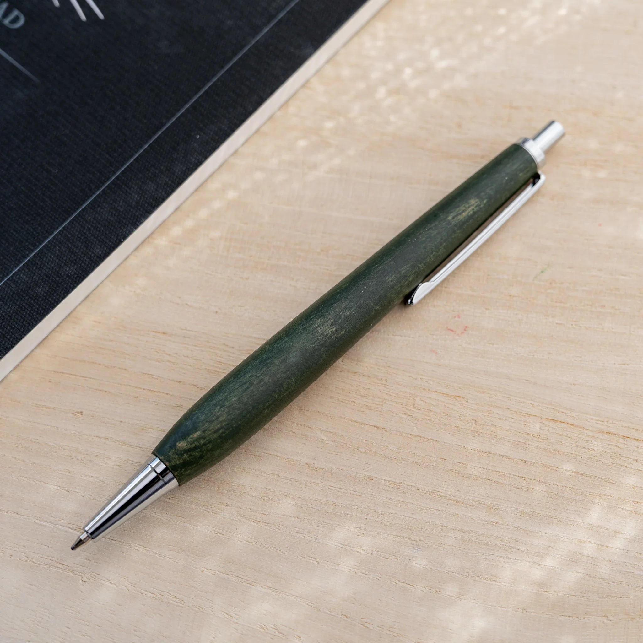 Horse chestnut wood urushi lacquered ballpoint pen in olive green, Japanese wood, silver knock and clip