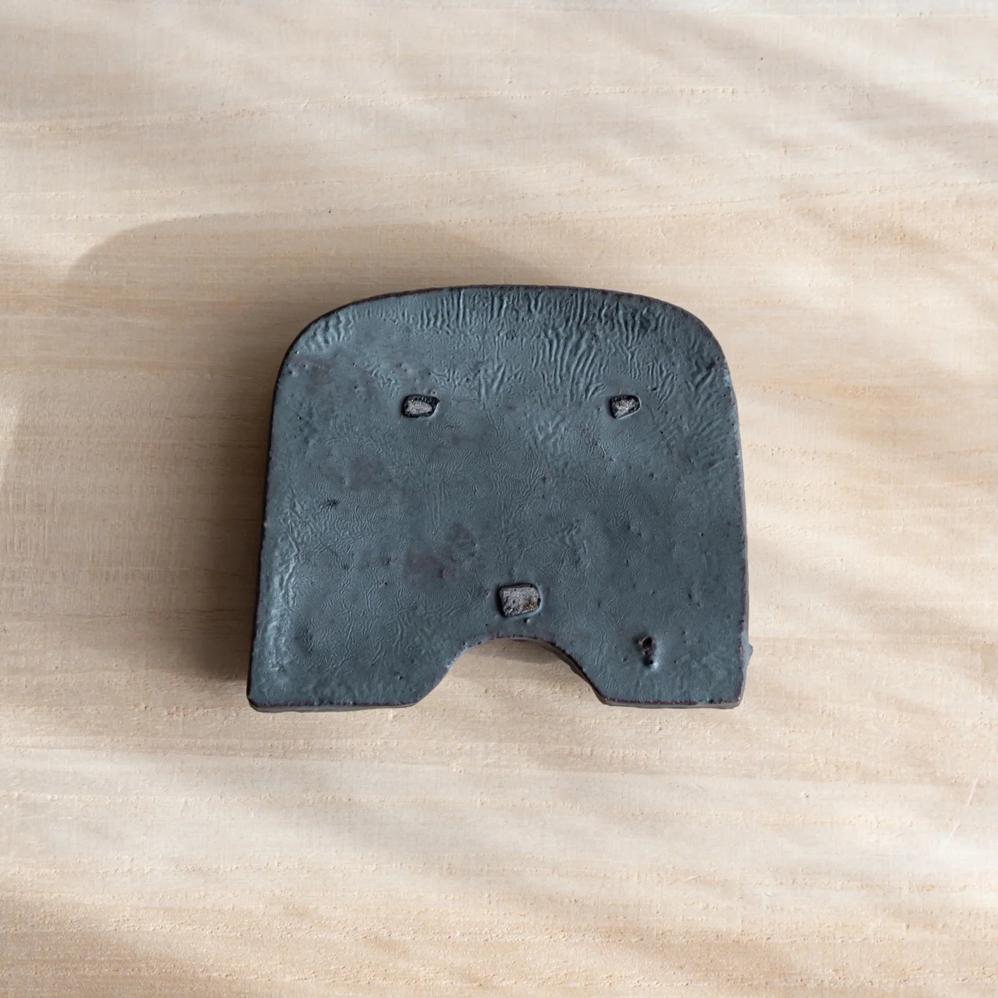 Back view of Japanese Paperweight inspired by Oni-gawara roof tiles, showing ceramic texture as a refined Desk Accessory.