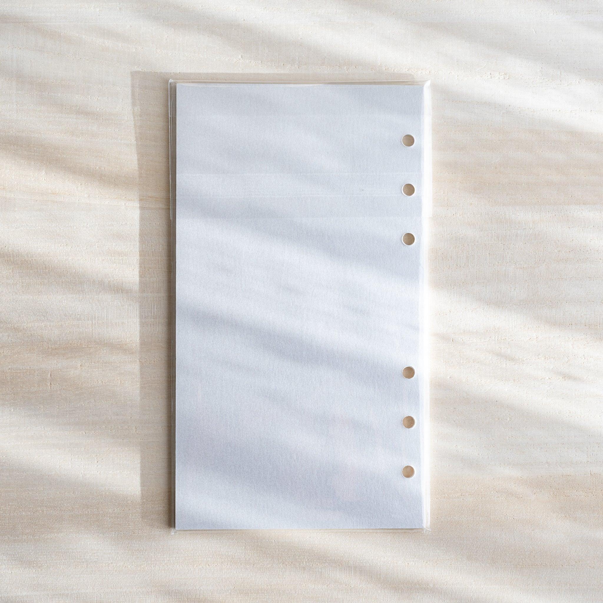 Japanese onion skin planner refill sheet in Bible size, shown flat with six-hole punches on a light textured background.