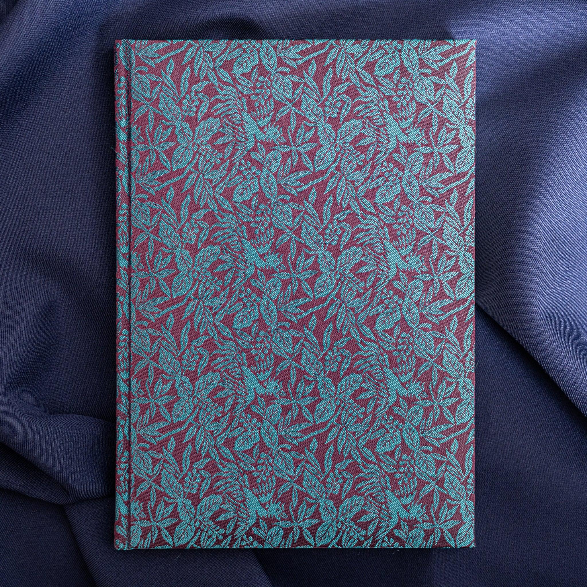 Kiri Take Ho-o Nishijin silk Homeicho notebook front cover showing teal and maroon woven floral and leaf pattern