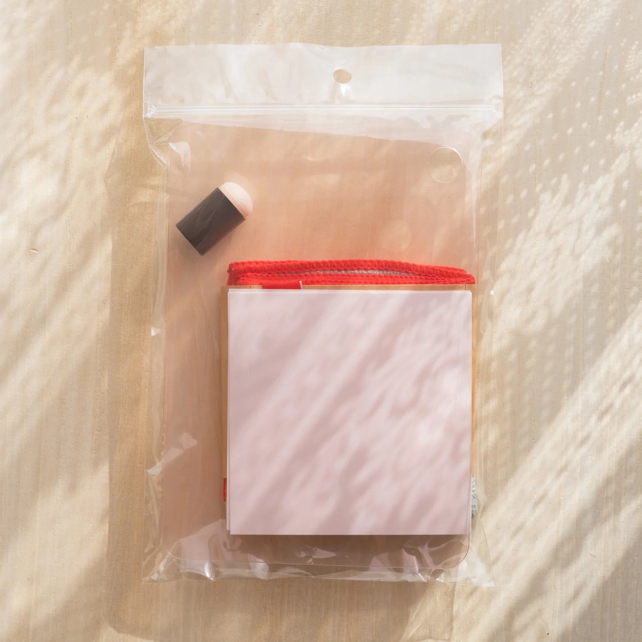 Kitpas watercolor crayon set with all 16 colors displayed in the canvas linen bag opened flat layout