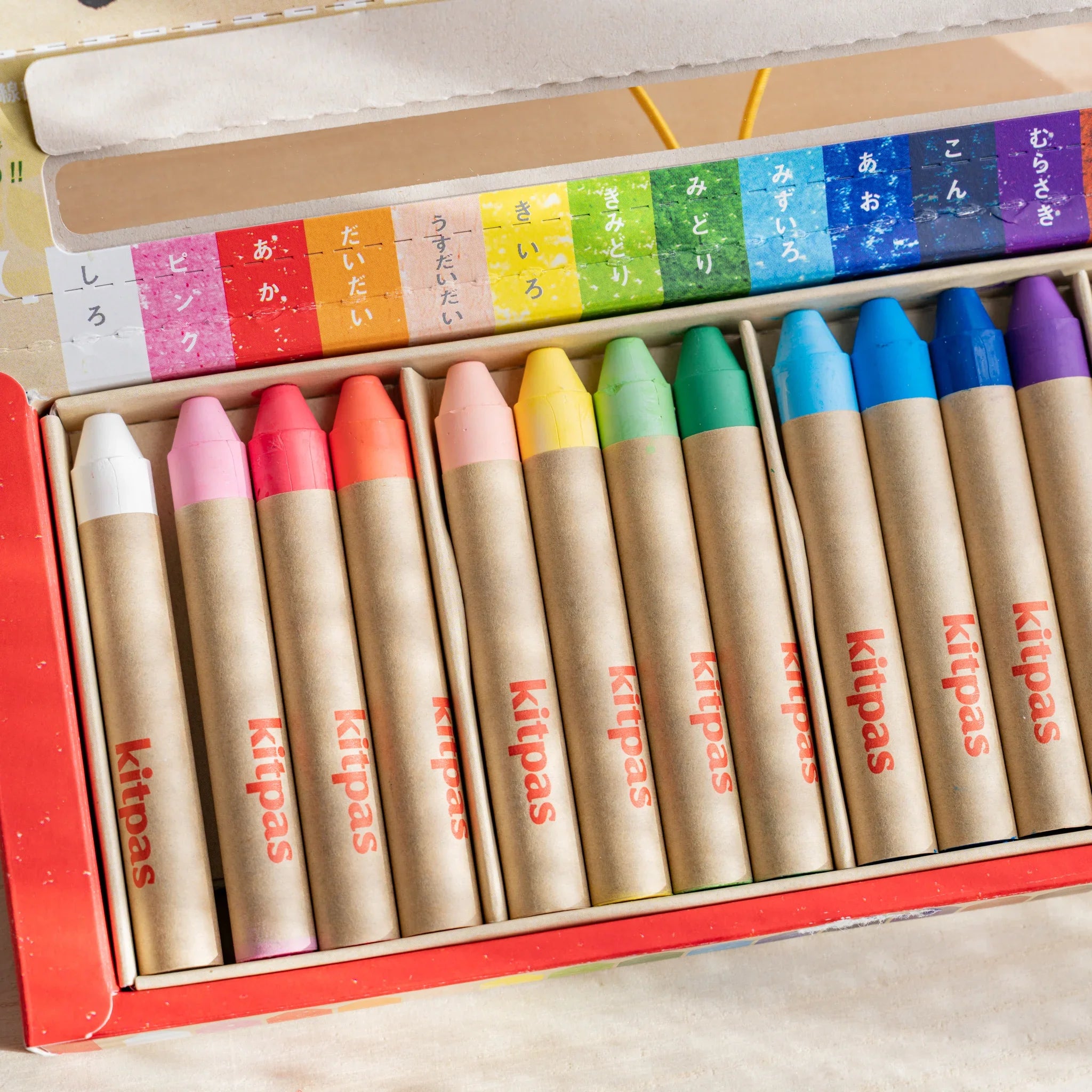 Kitpas watercolor crayons displayed in rows showing the sequential color order from light to dark shades