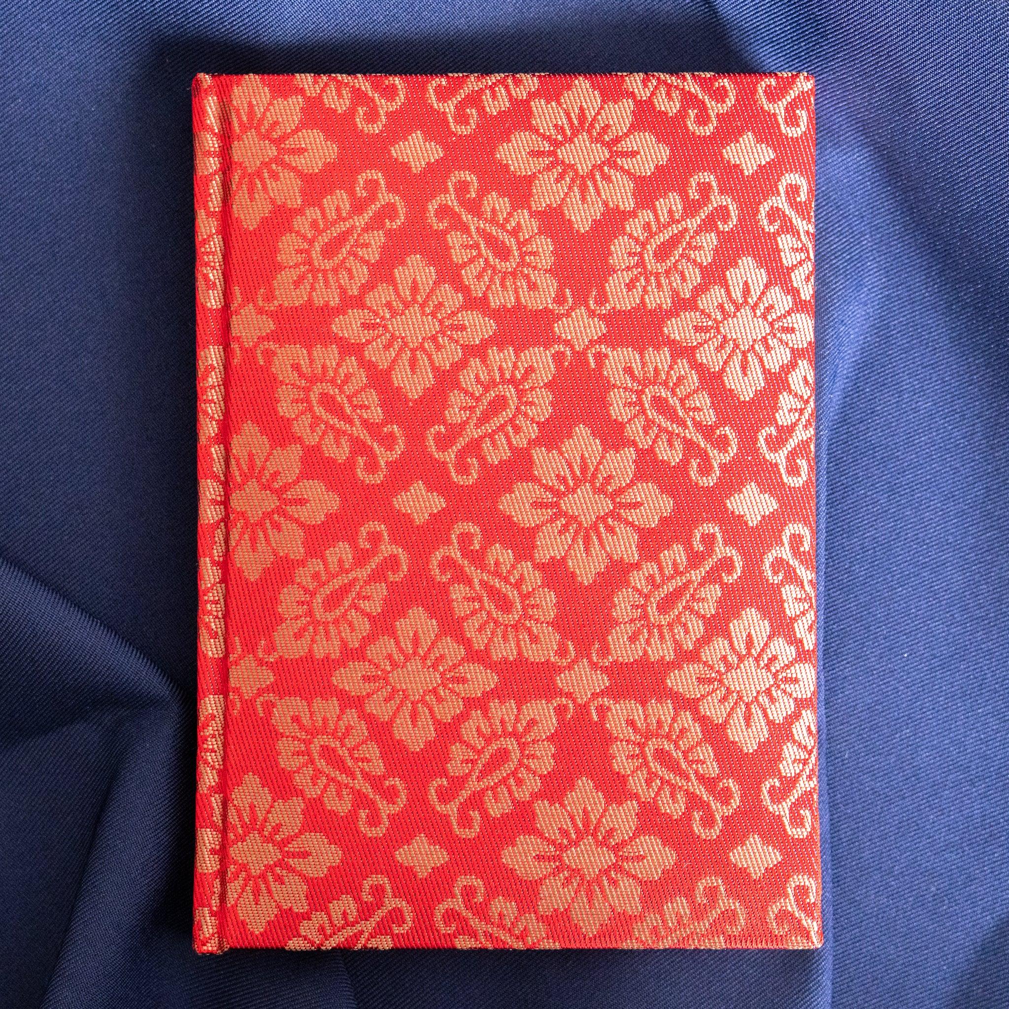 Ko Aoi Nishijin silk Homeicho notebook straight-on front cover without paper band showing full vermilion hollyhock pattern