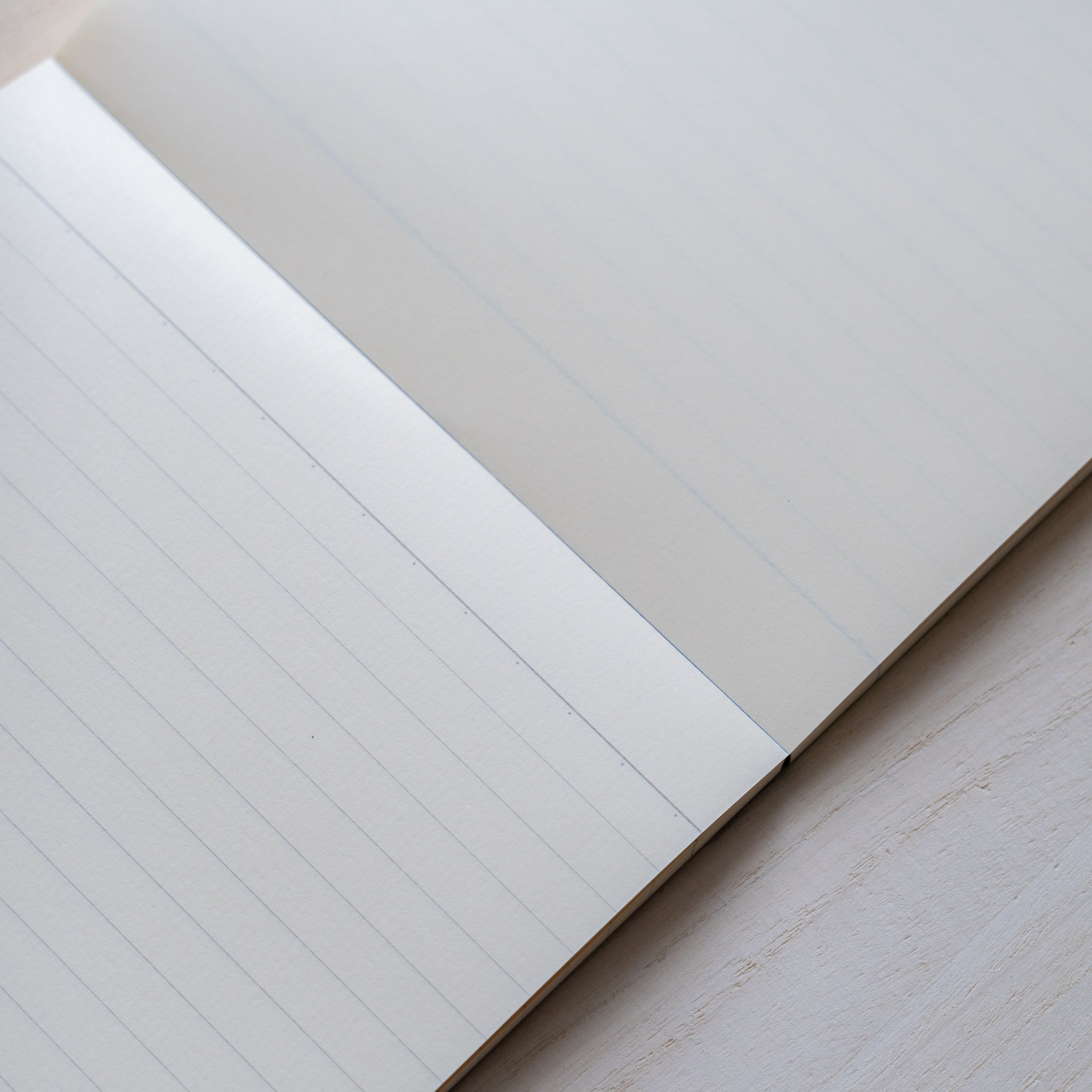 Life Noble writing pad lined pages shown at an angle, smooth cream Japanese paper with clean edges for everyday writing