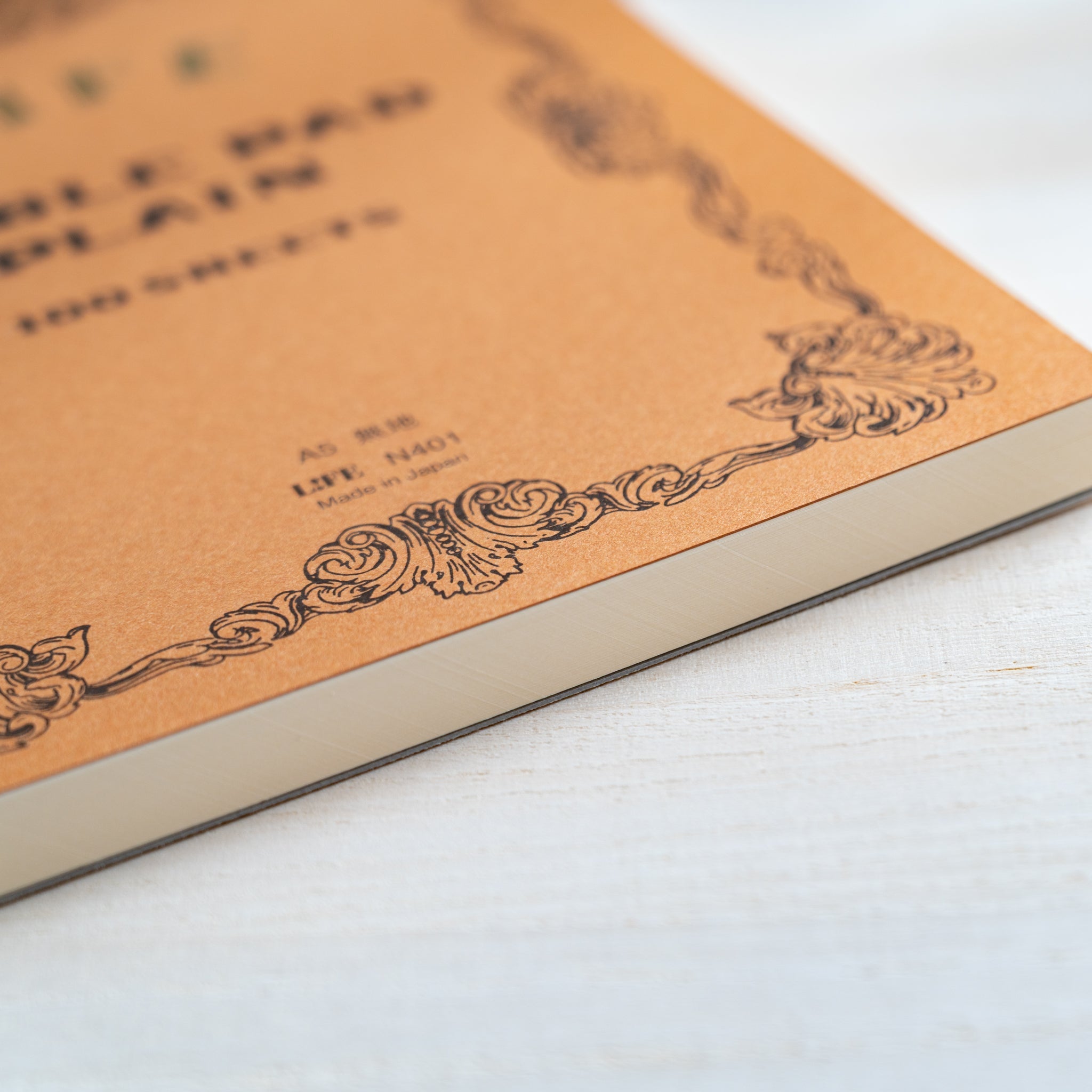 Life Noble writing pad cover close-up showing vintage decorative border and thick paper edge, classic Japanese stationery design