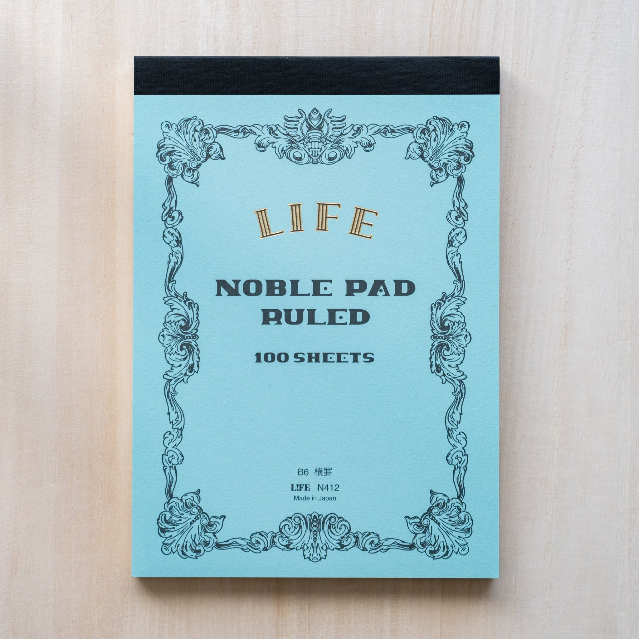 Life noble writing pad B6 blue Noble Pad Ruled cover shown flat, LIFE logo, vintage frame design, 100 sheets text