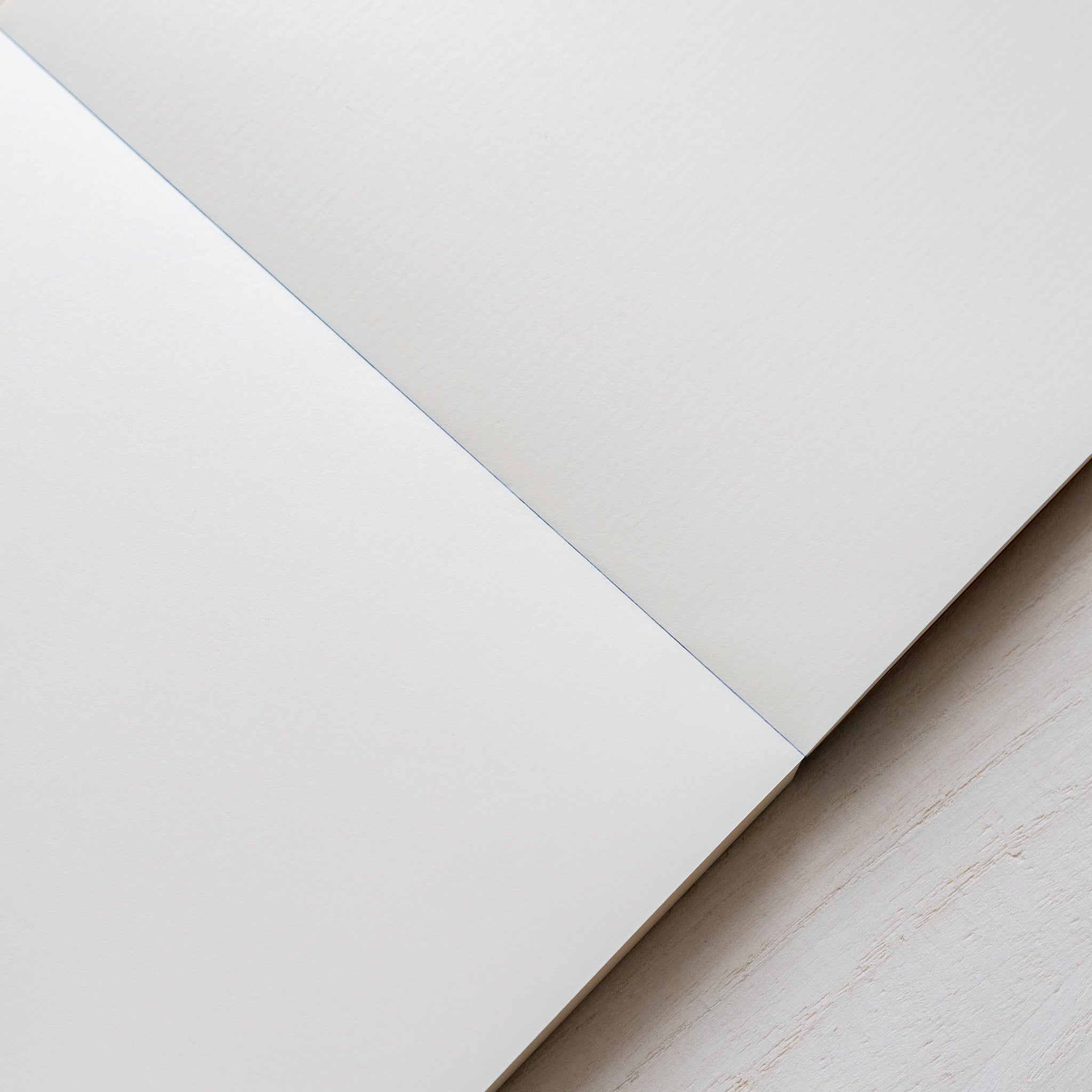 Life noble writing pad B6 close-up at an angle, smooth cream L Writing Paper surface and clean cut edges visible